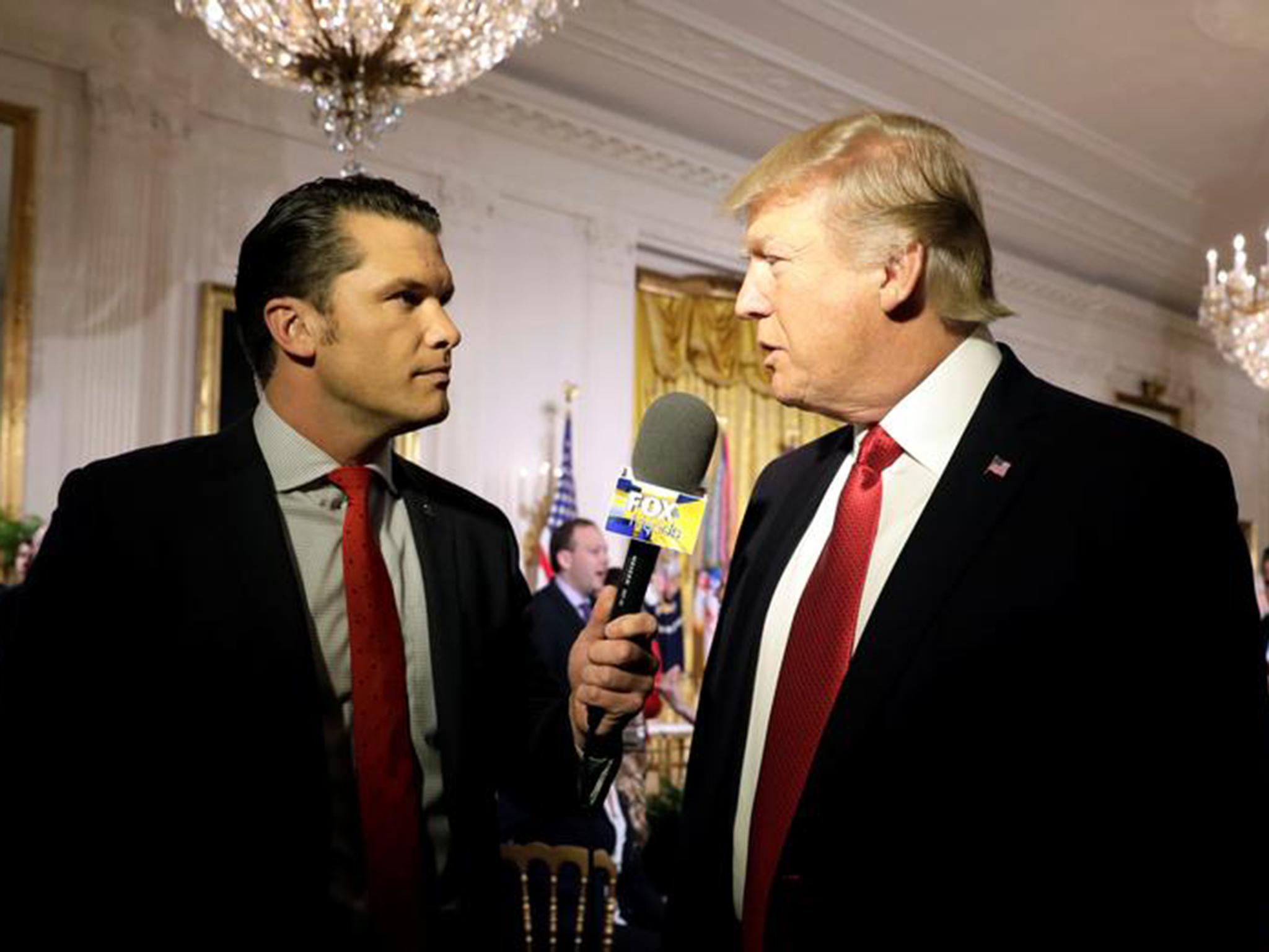 Hegseth interviewing Trump at the White House in 2017