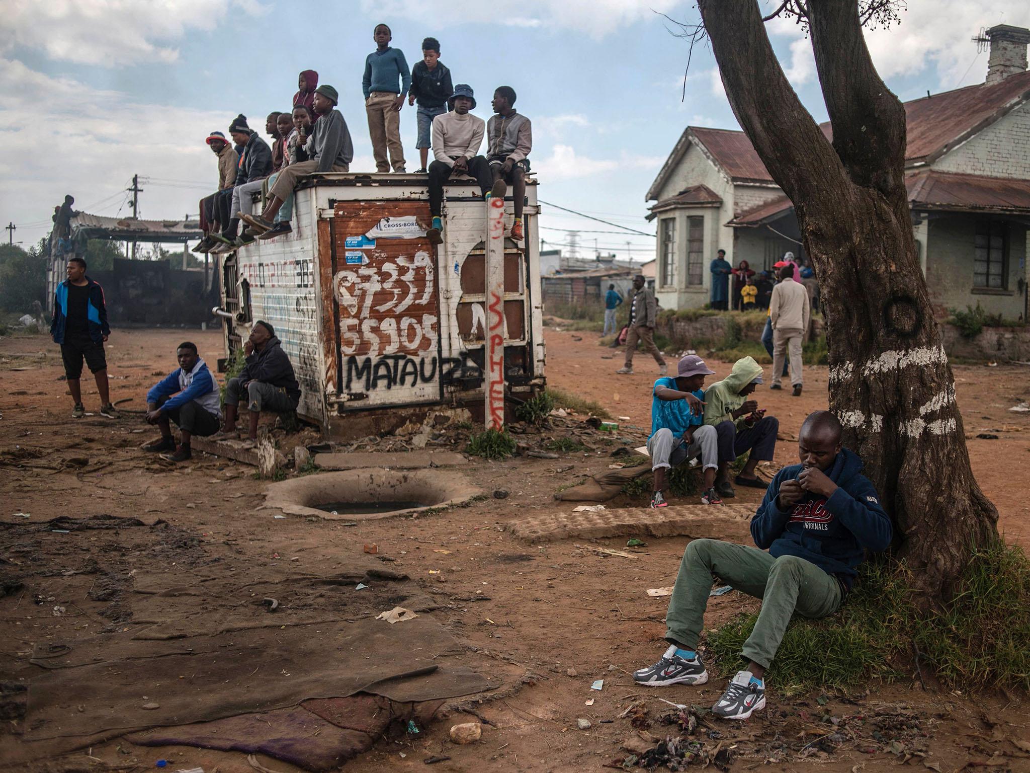 Residents of Mathole township in Roodepoort. near Johannesburg (Getty)