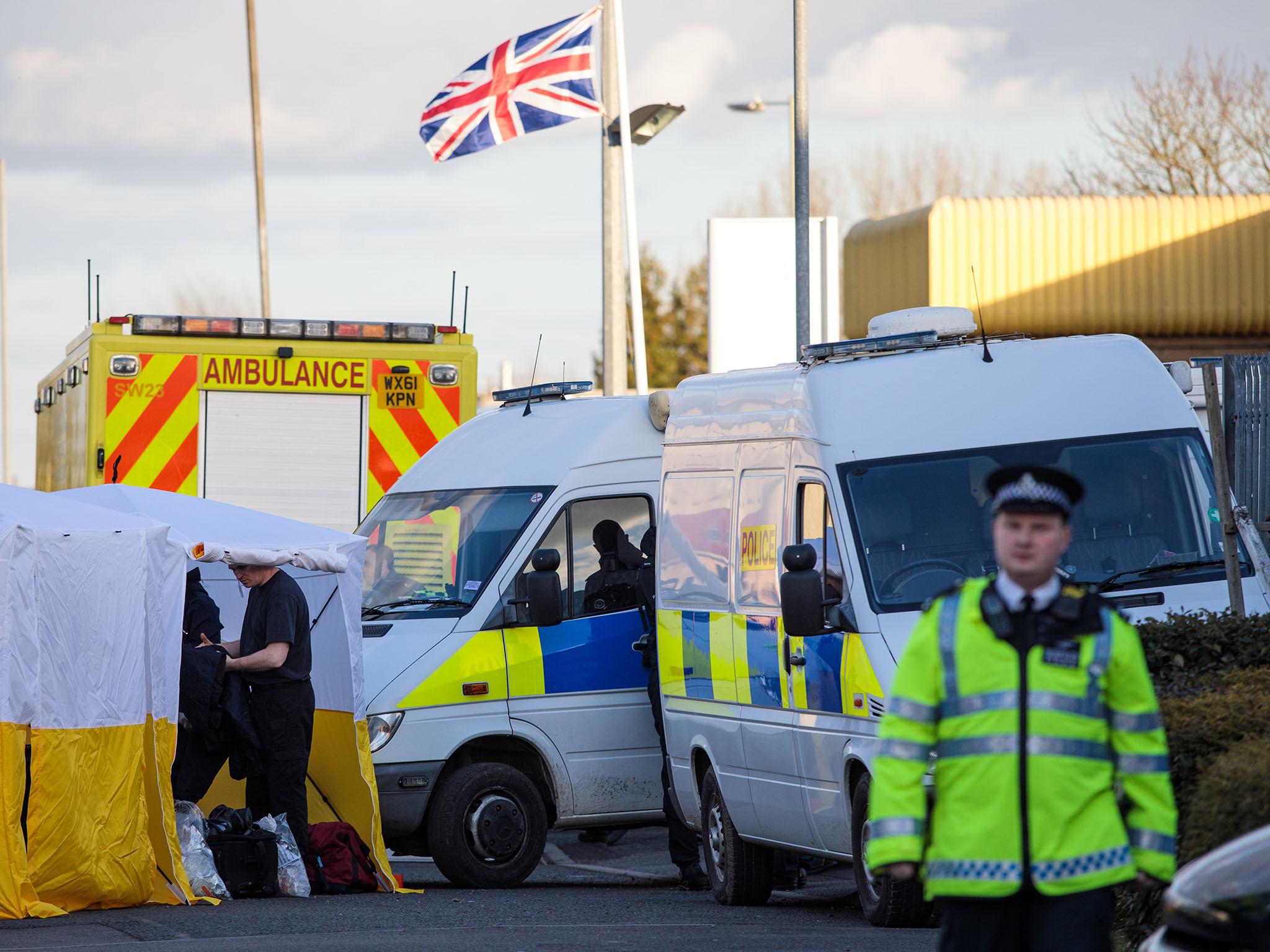 Police offers inspect the scene of the nerve-agent attack in Sailsbury