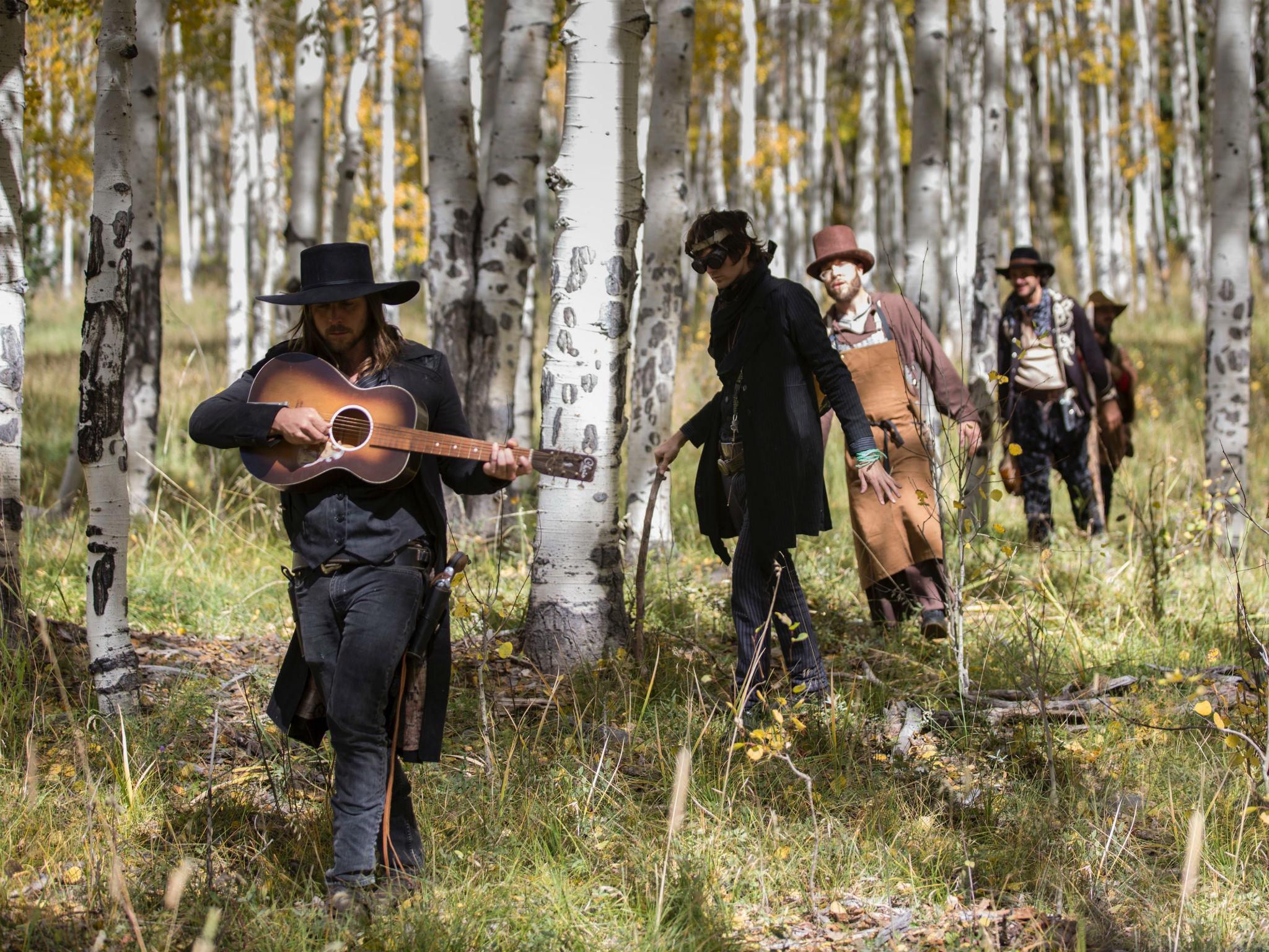 Sometime in the future past, a ragged band of cowboys and outlaws, led by Young with the band Promise of the Real, hide high up in the mountains