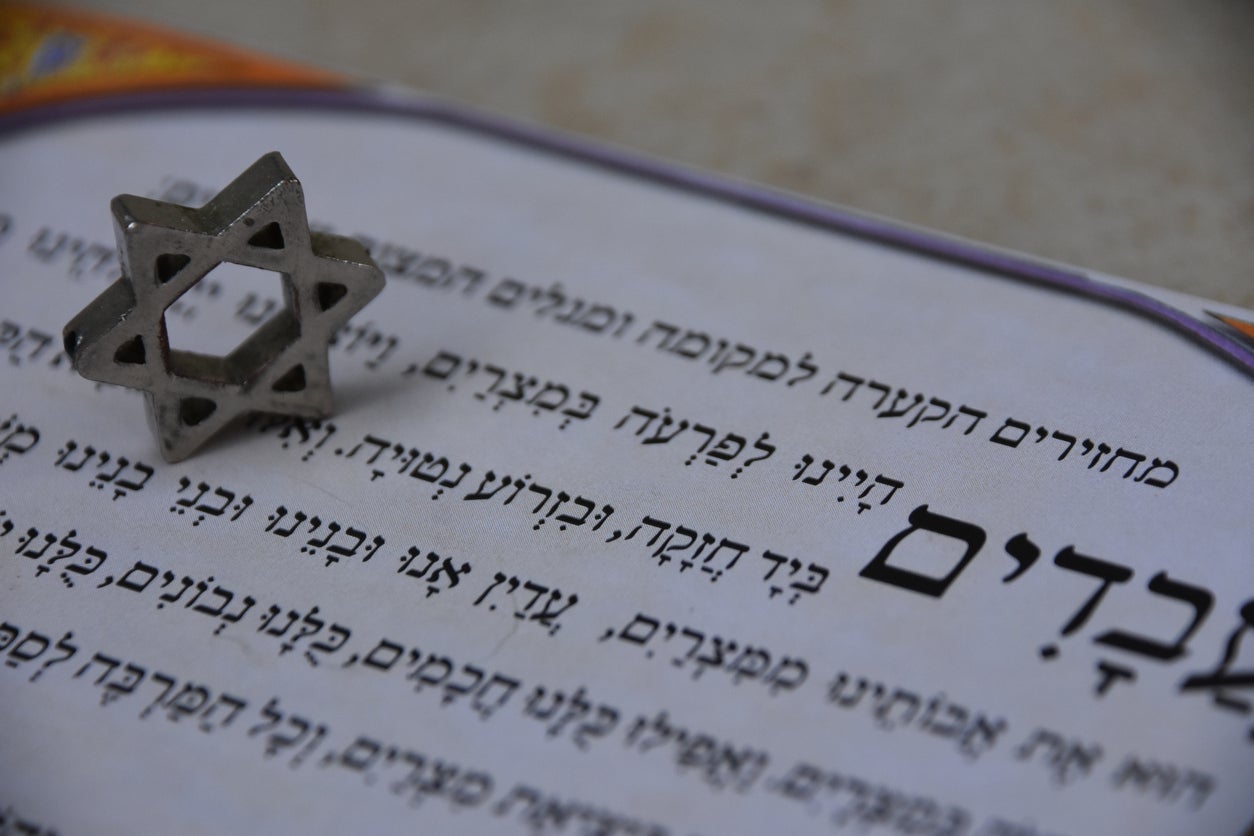 Jewish people read from the Haggadah during the Seder night