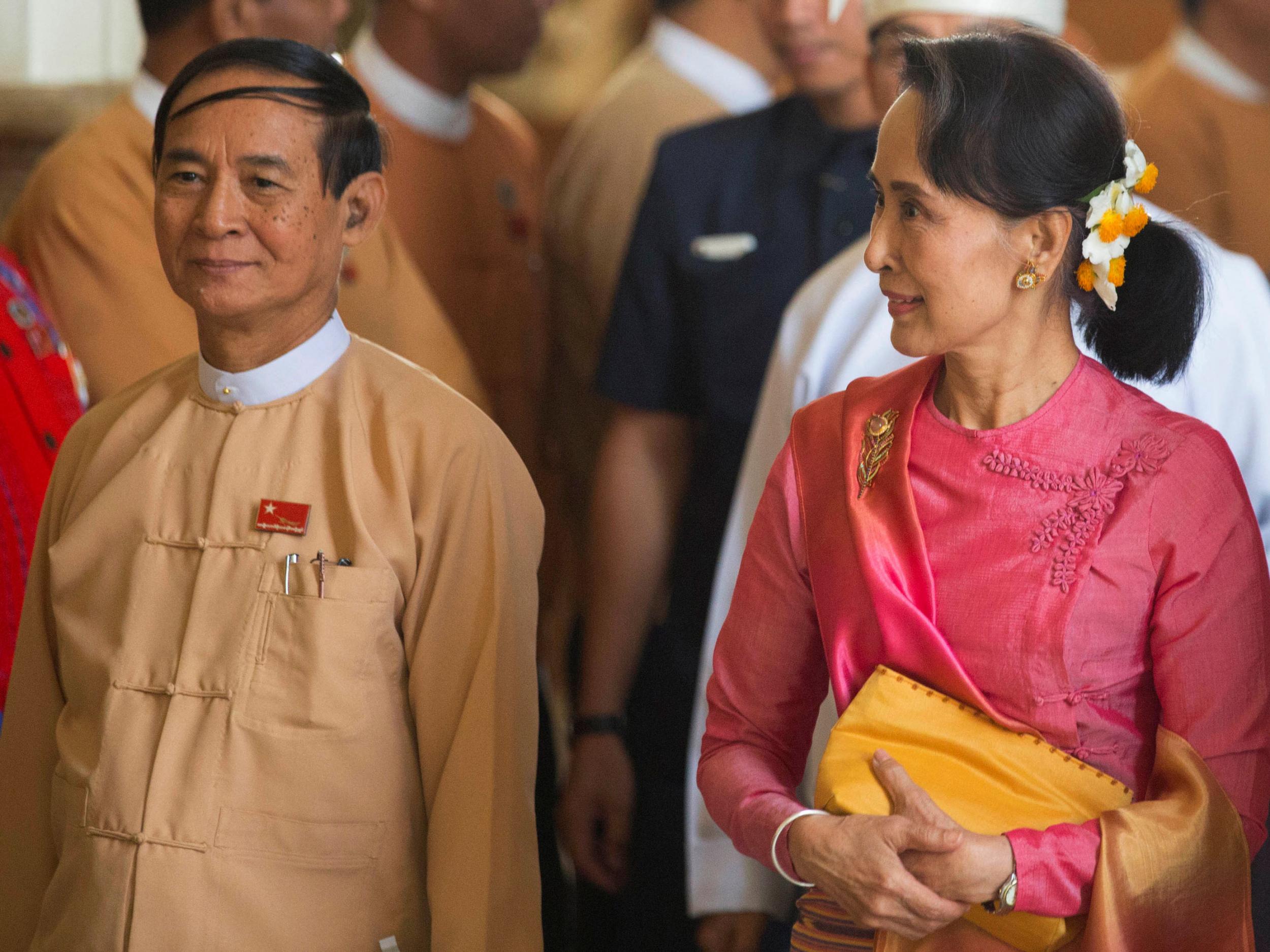 Aung San Suu Kyi (right) and Win Myint (left) attend a parliament session to elect the country's new president, in Naypyitaw, Myanmar, March 28, 2018