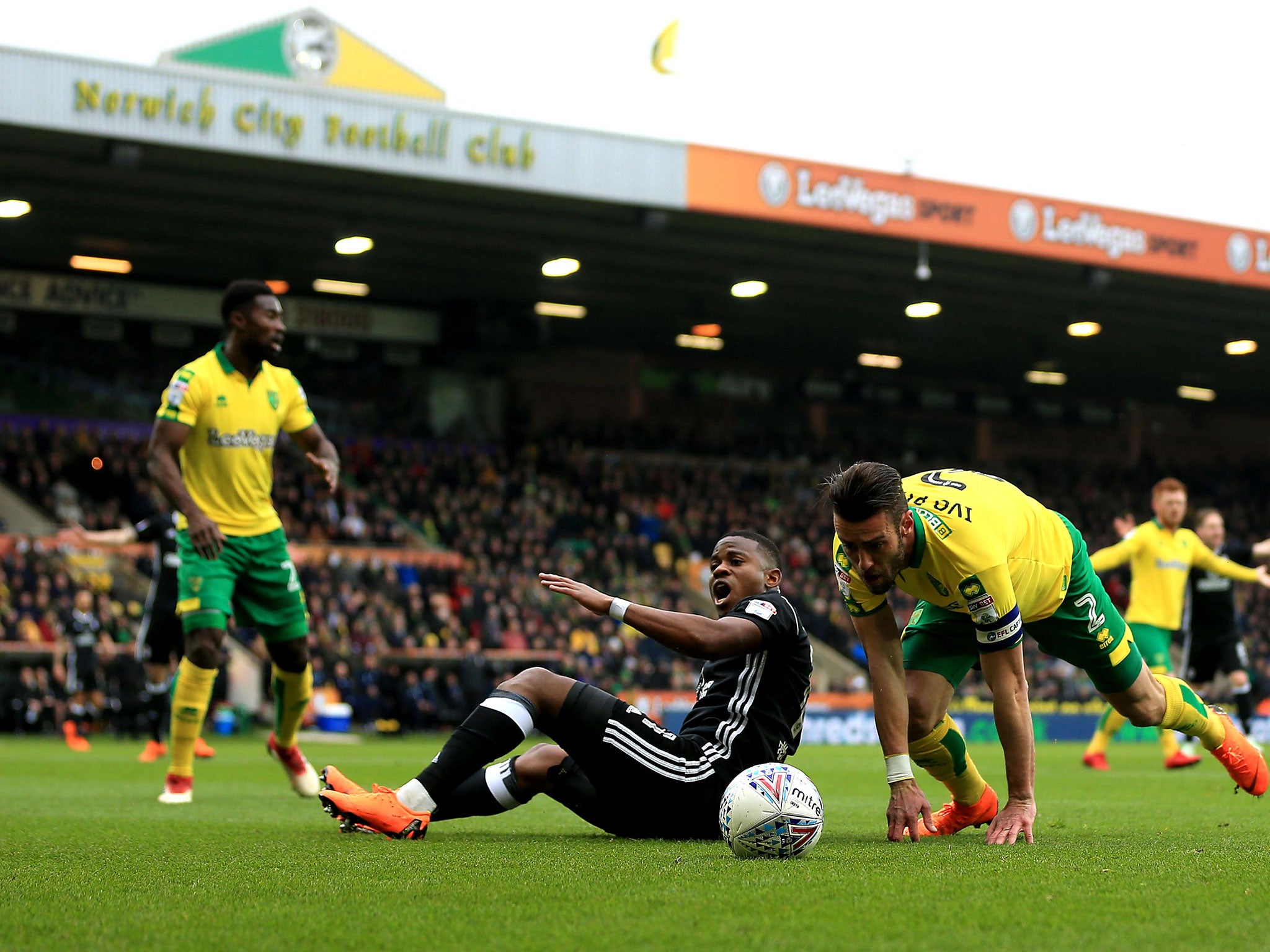 Floyd Ayite appeals for a foul after a challenge with Ivo Pinto