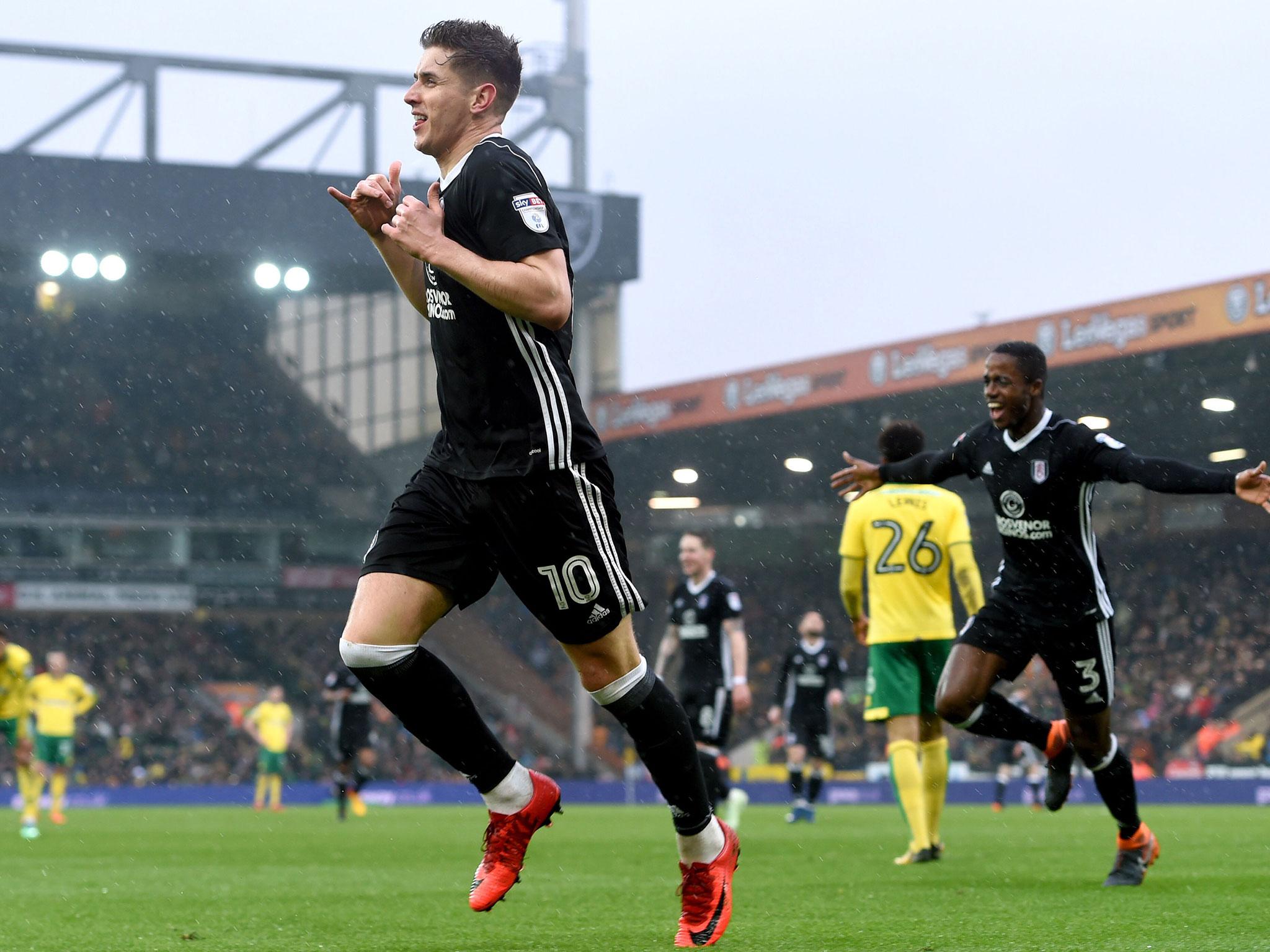 Tom Cairney celebrates after adding Fulham's second