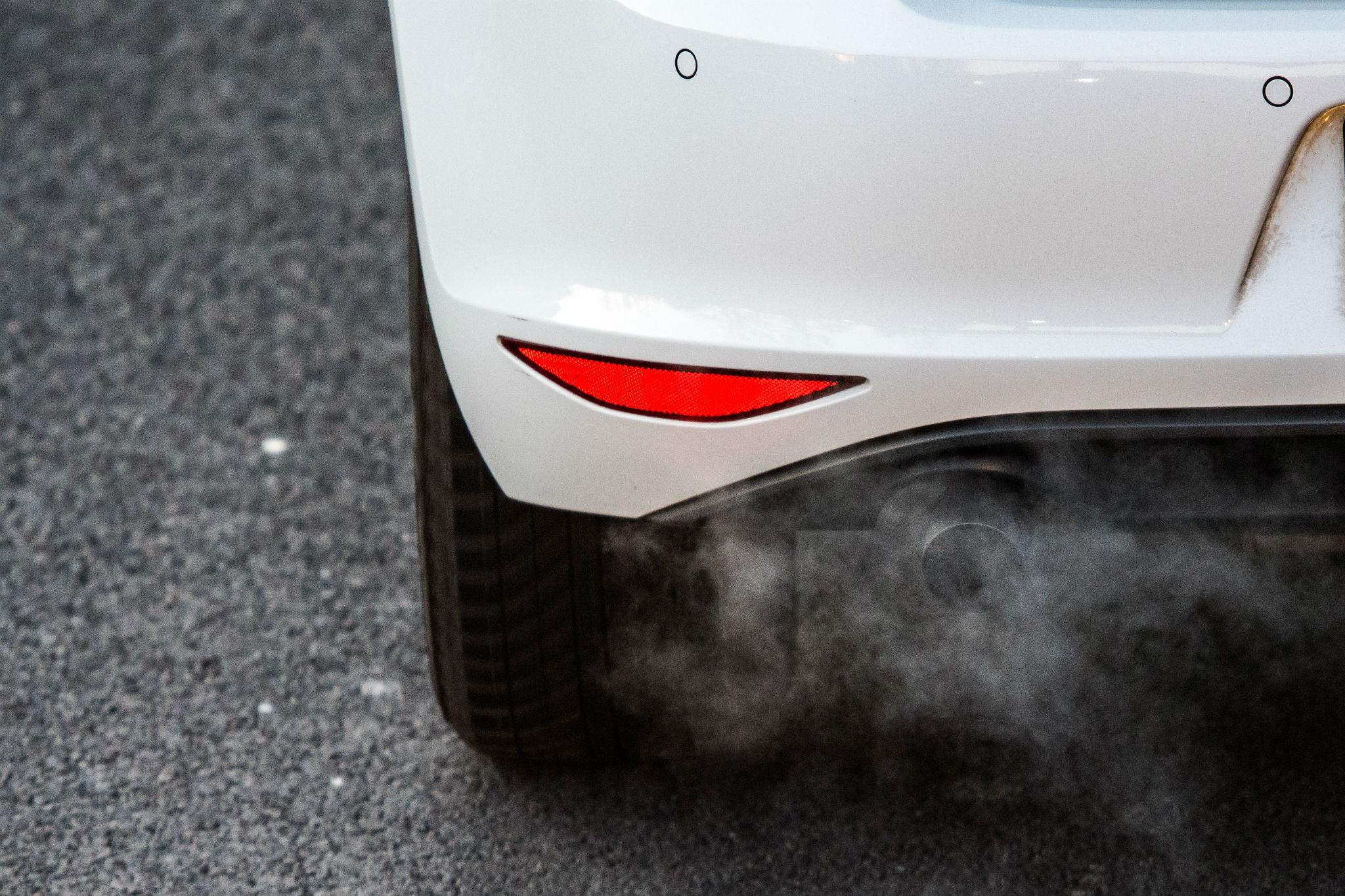 A car emits exhaust fumes