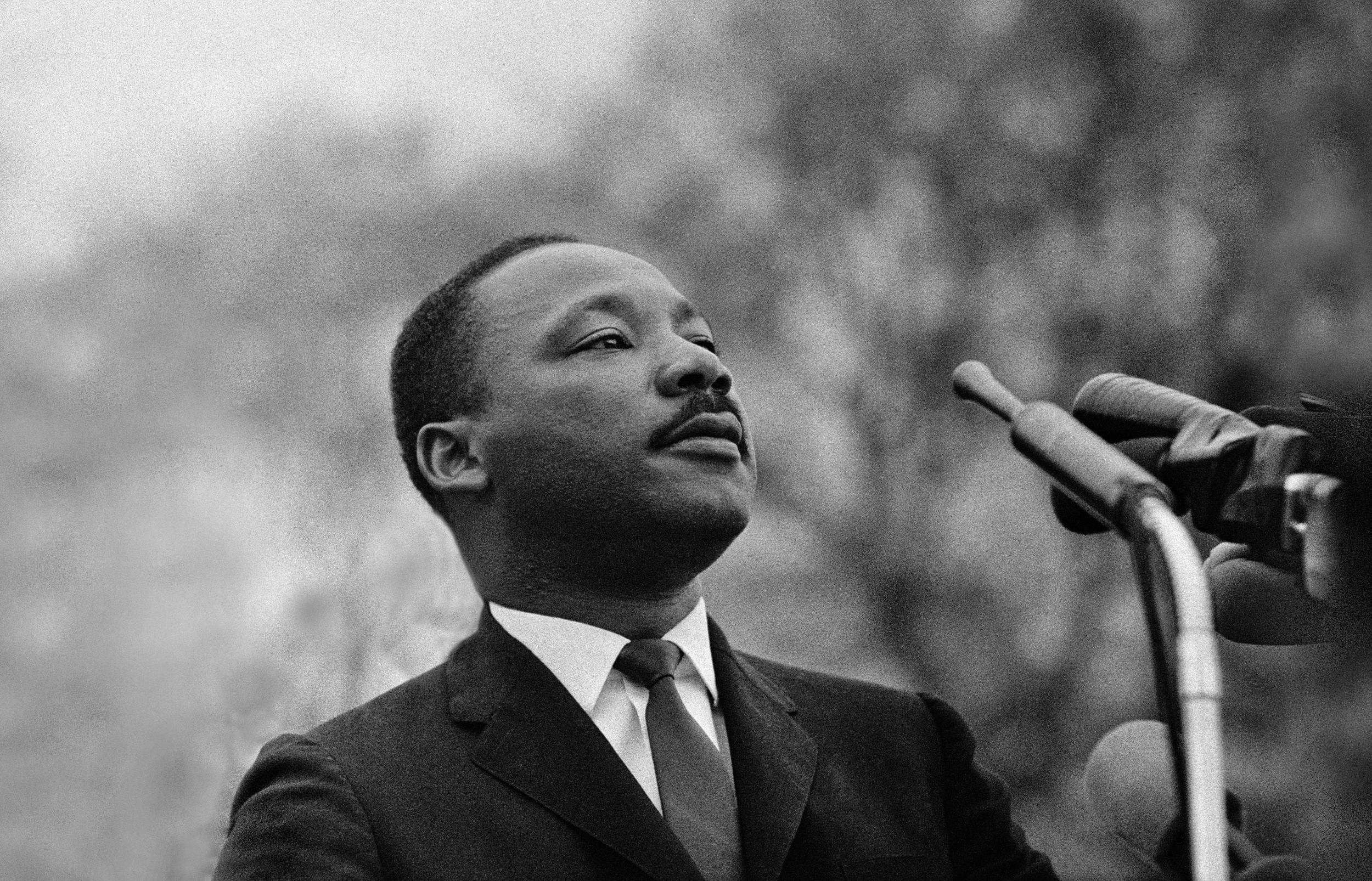 Martin Luther King, Jr speaking before crowd of 25,000 Selma To Montgomery, Alabama civil rights marchers