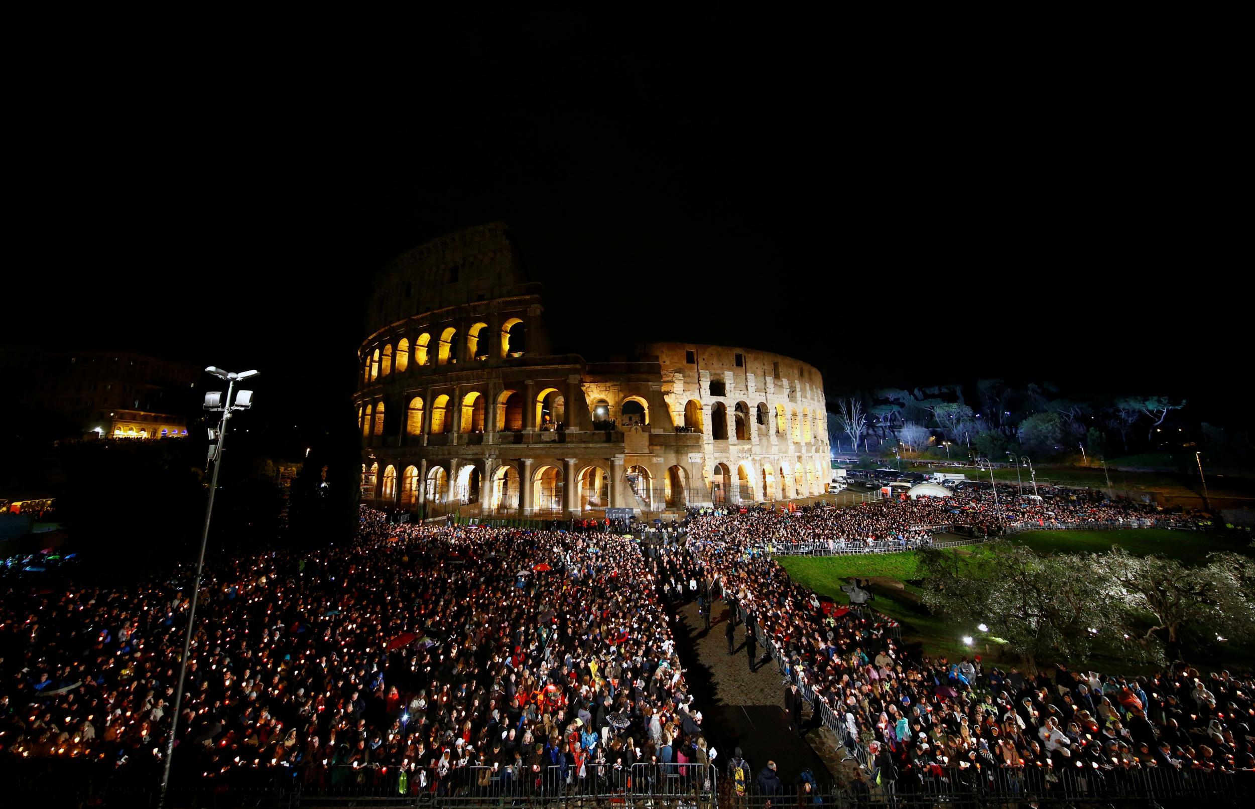 The crowd watch and listen as the Pope gives his Easter address