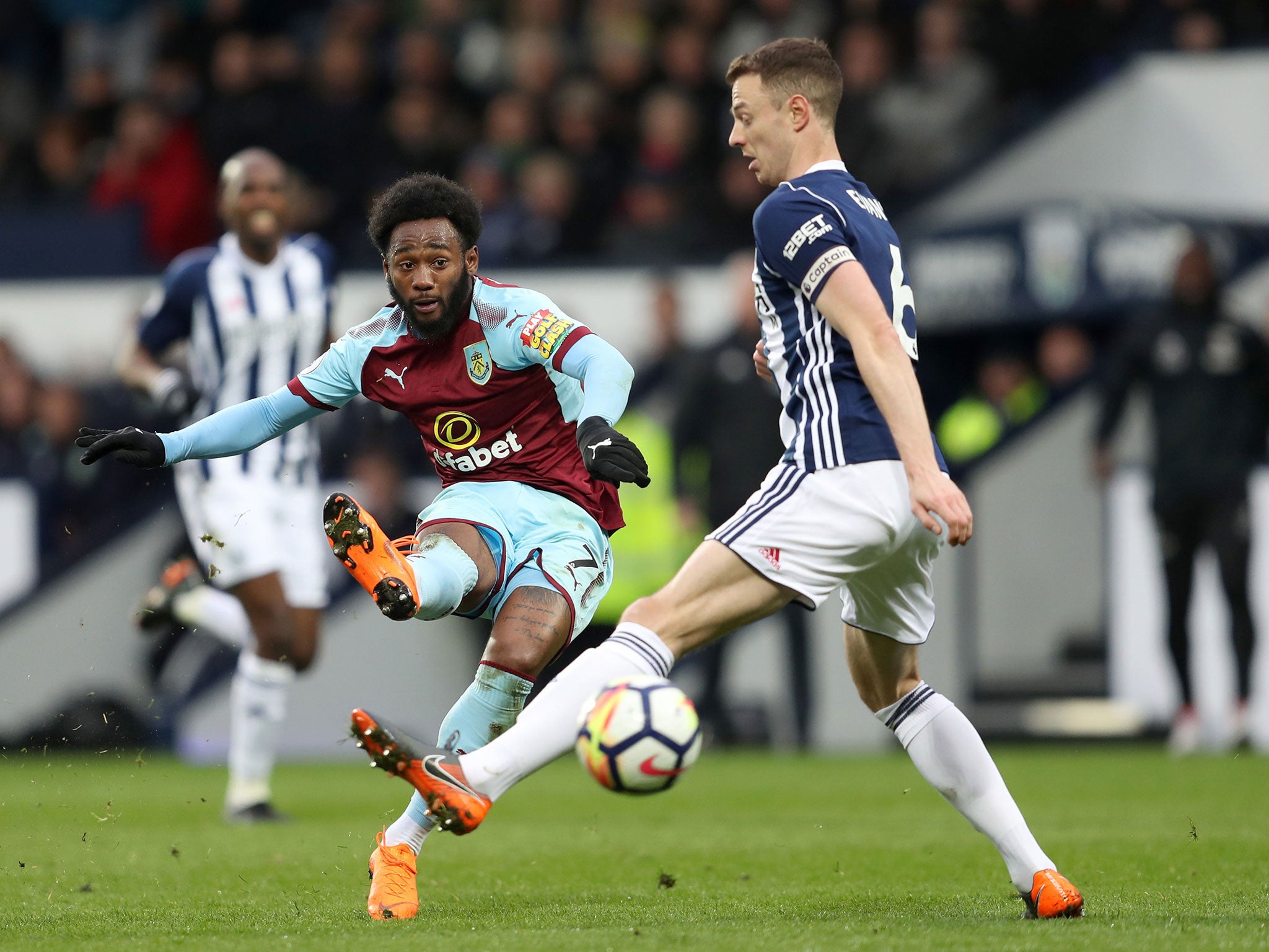 Georges-Kevin N'Koudou squeezes a shot past Jonny Evans