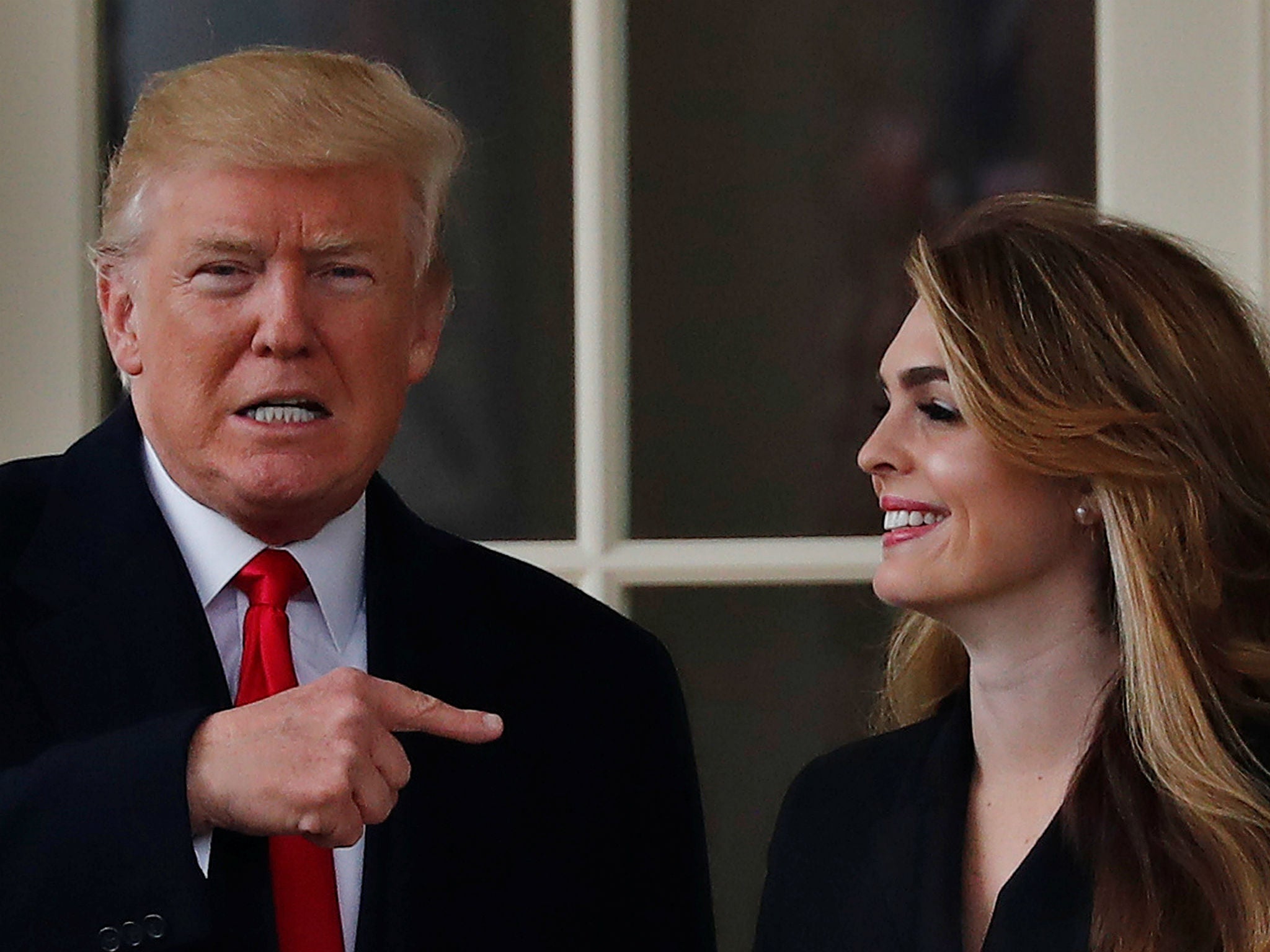 Donald Trump stands next to Hope Hicks outside the Oval Office