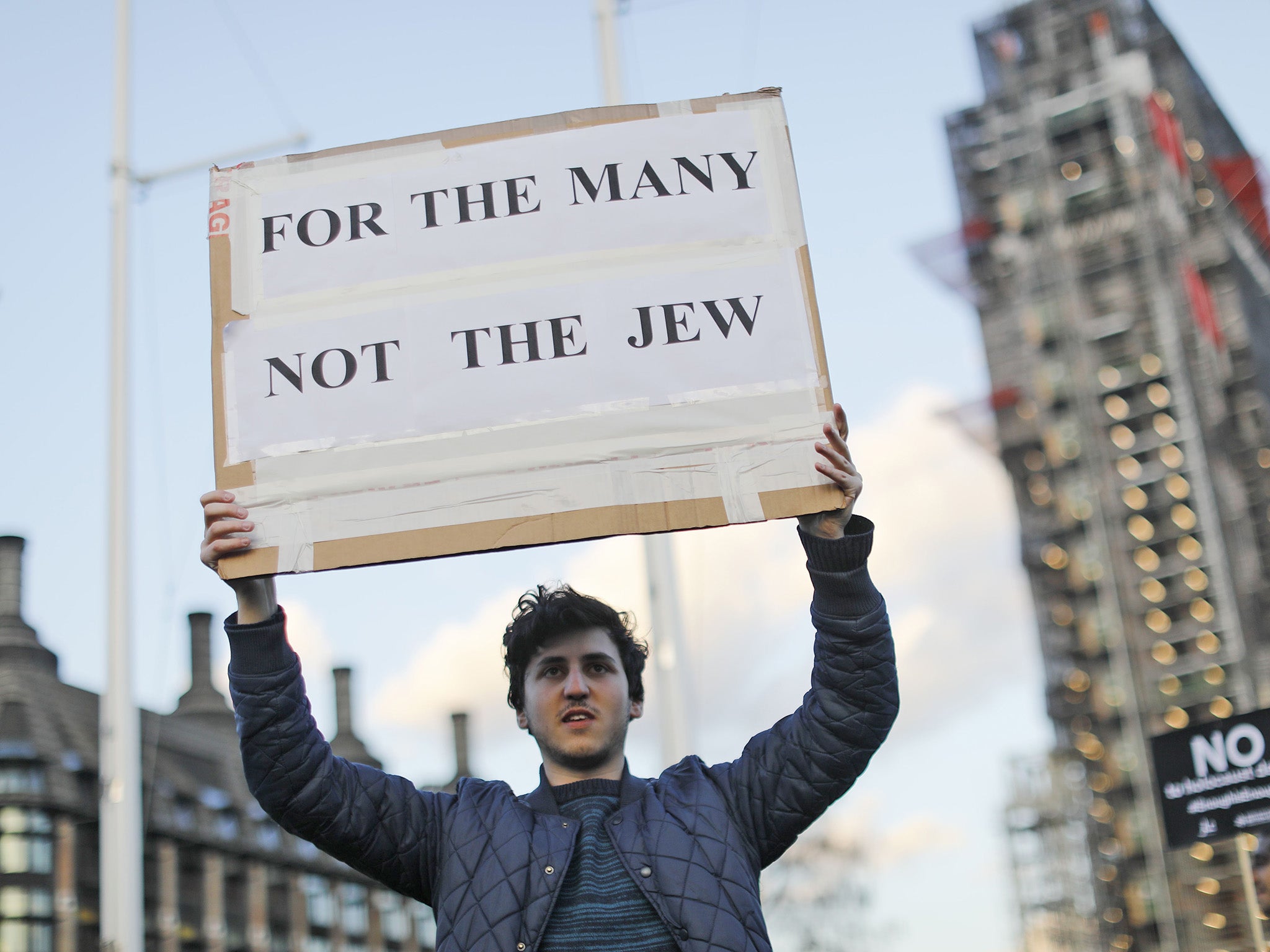 A demonstrator calls for action over antisemitism in Westminster in March last year