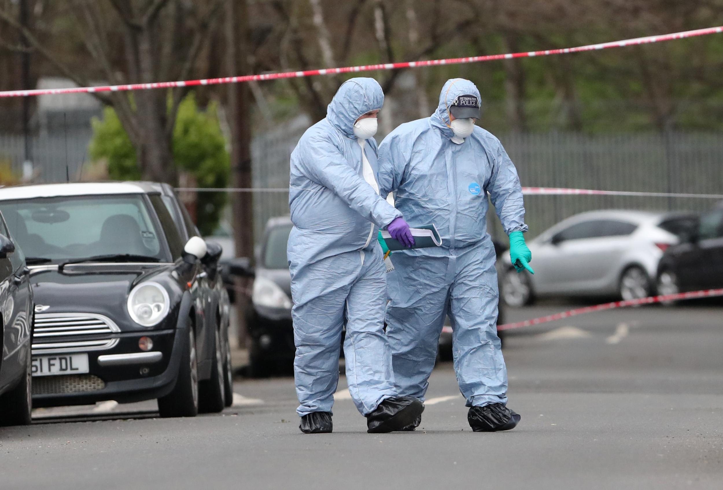 Forensic officers on Further Green Road in Hither Green, London