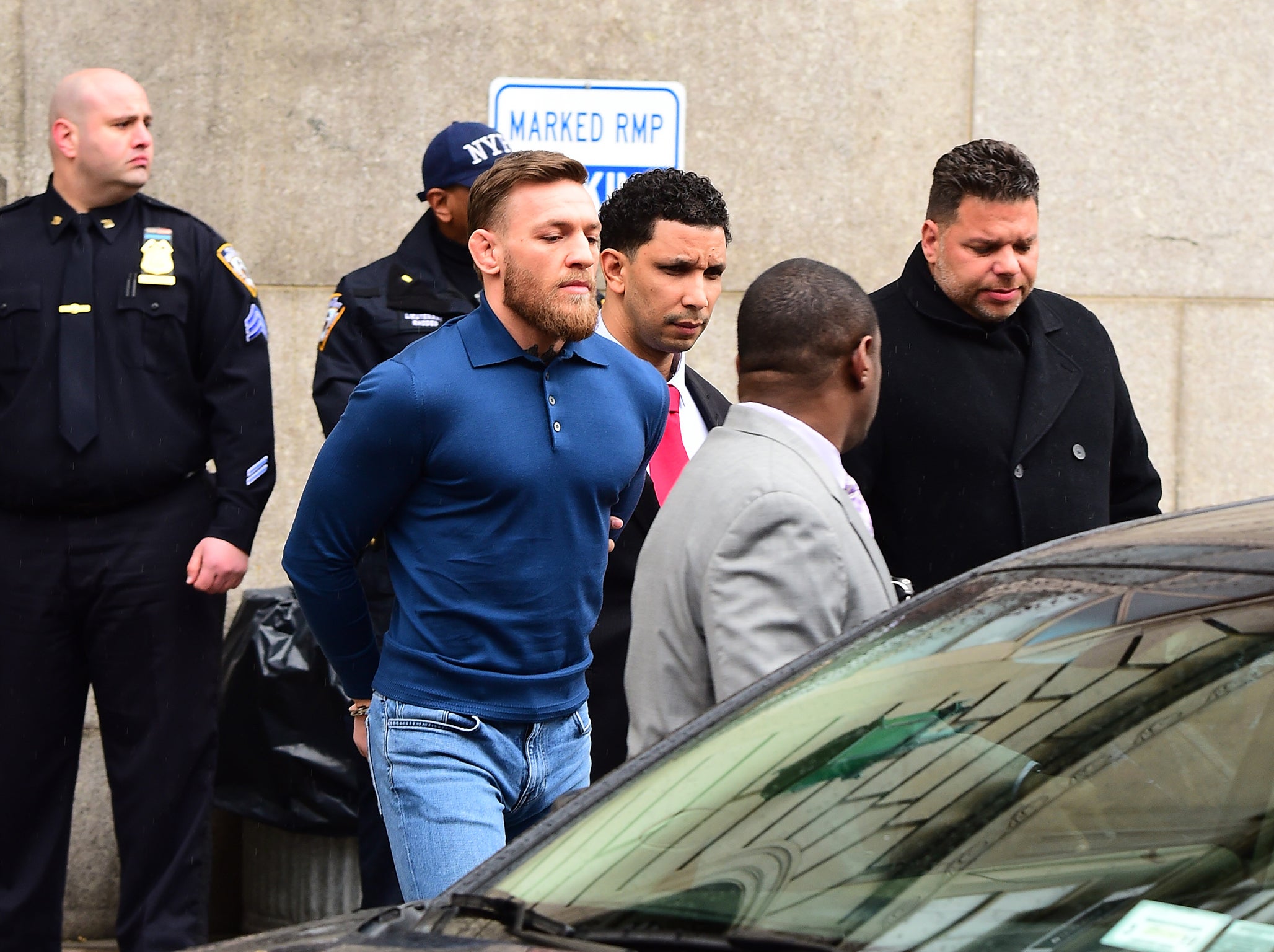 Conor McGregor is led away