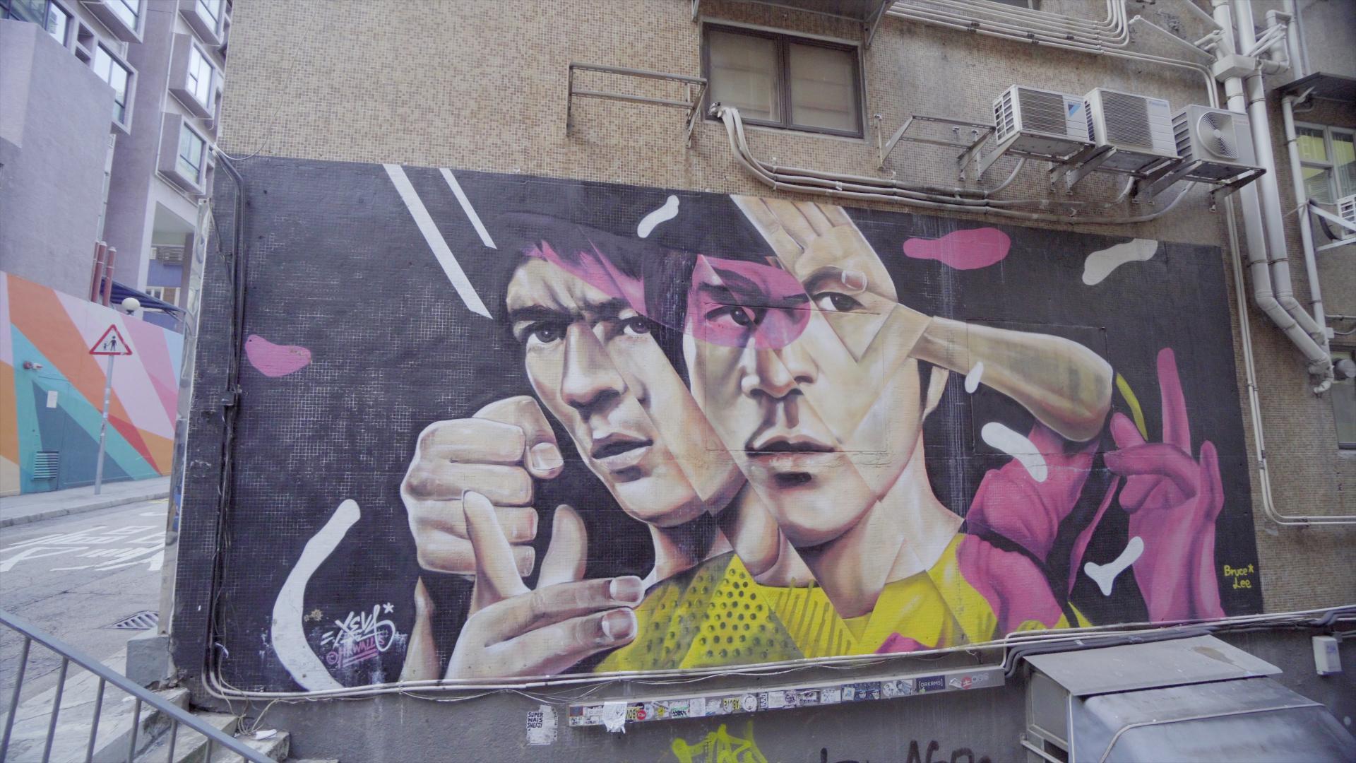 This mural of Bruce Lee is done by Korean graffiti artist Xeva using his mosaic technique