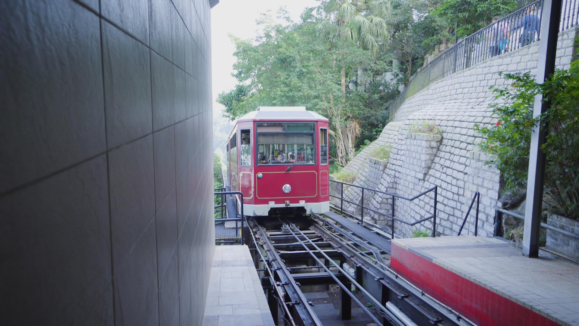 The Peak Tram is a furnicular railway carrying residents and tourists to Hong Kong Island's upper levels
