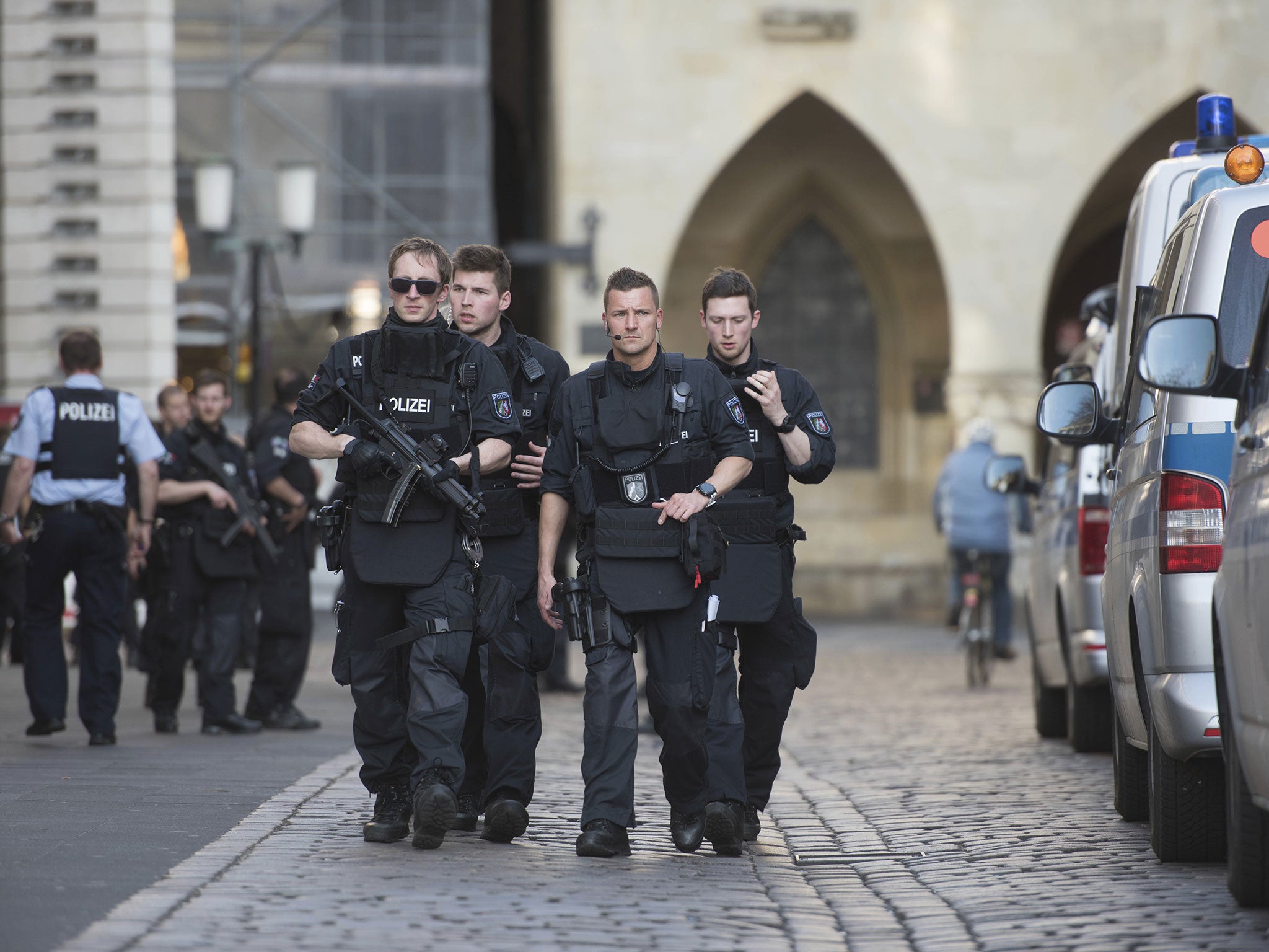 Police guard the streets of downtown Münster‬‬ following the crash