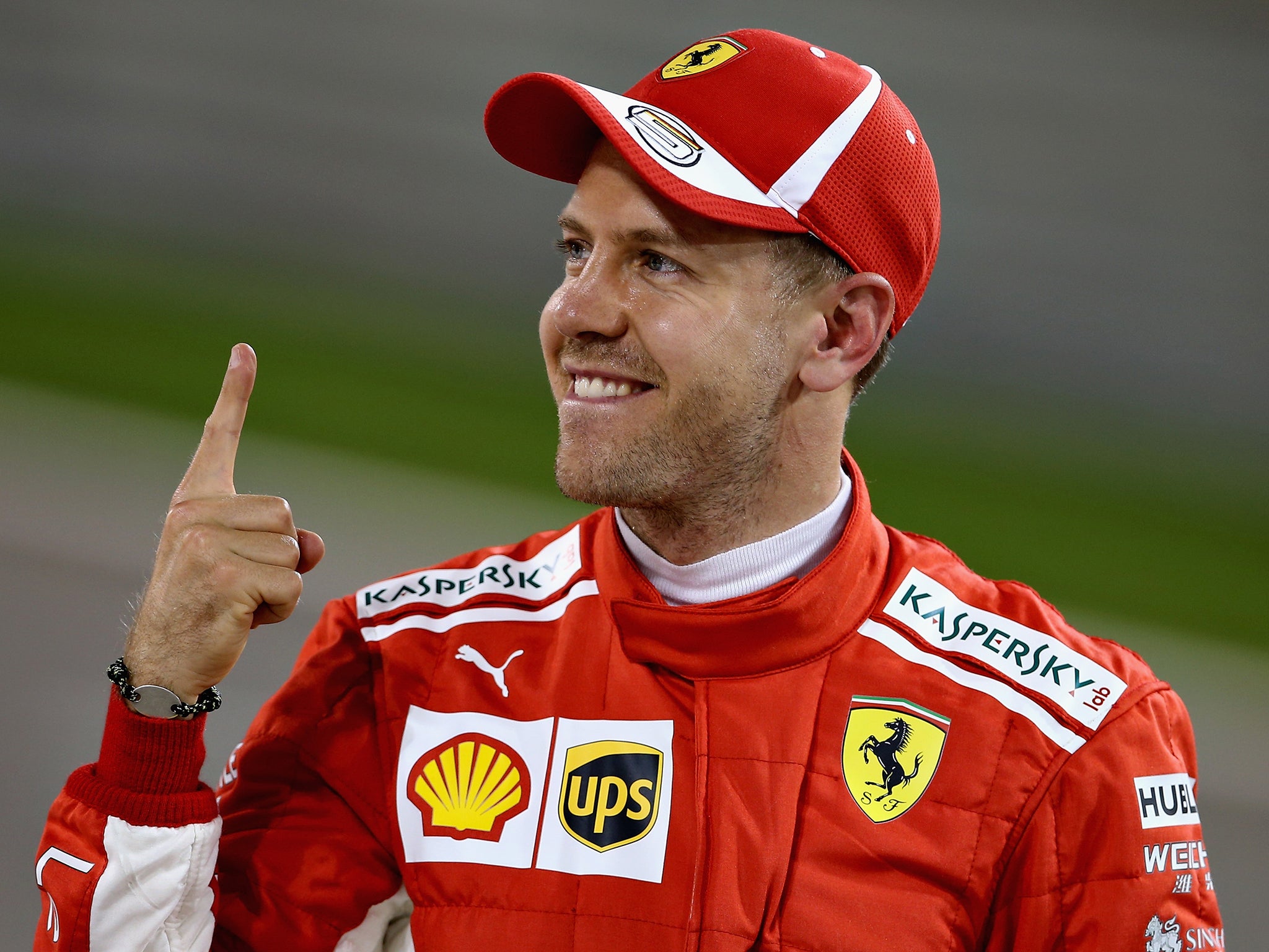 Sebastian Vettel celebrates his pole position for the Bahrain Grand Prix