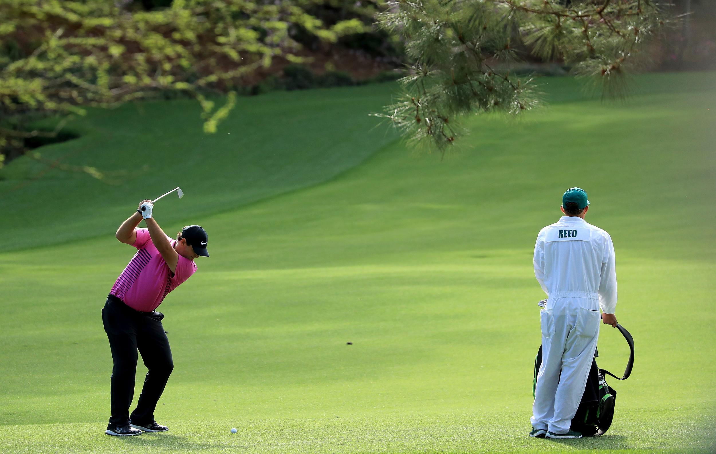 Patrick Reed plays his second shot on the 13th