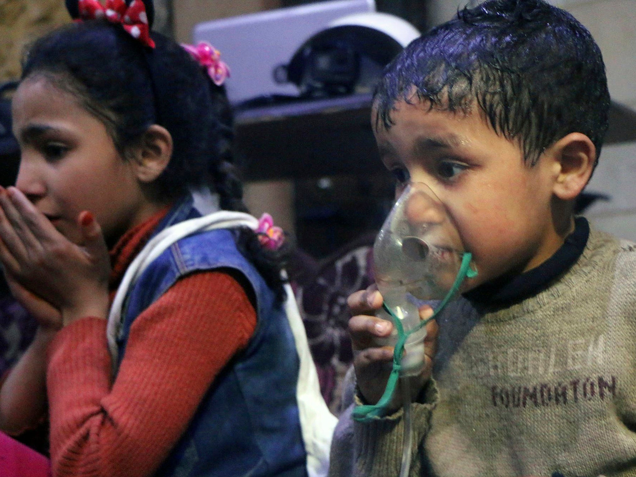 A child receiving oxygen through respirators following an alleged poison gas attack in the rebel-held town of Douma