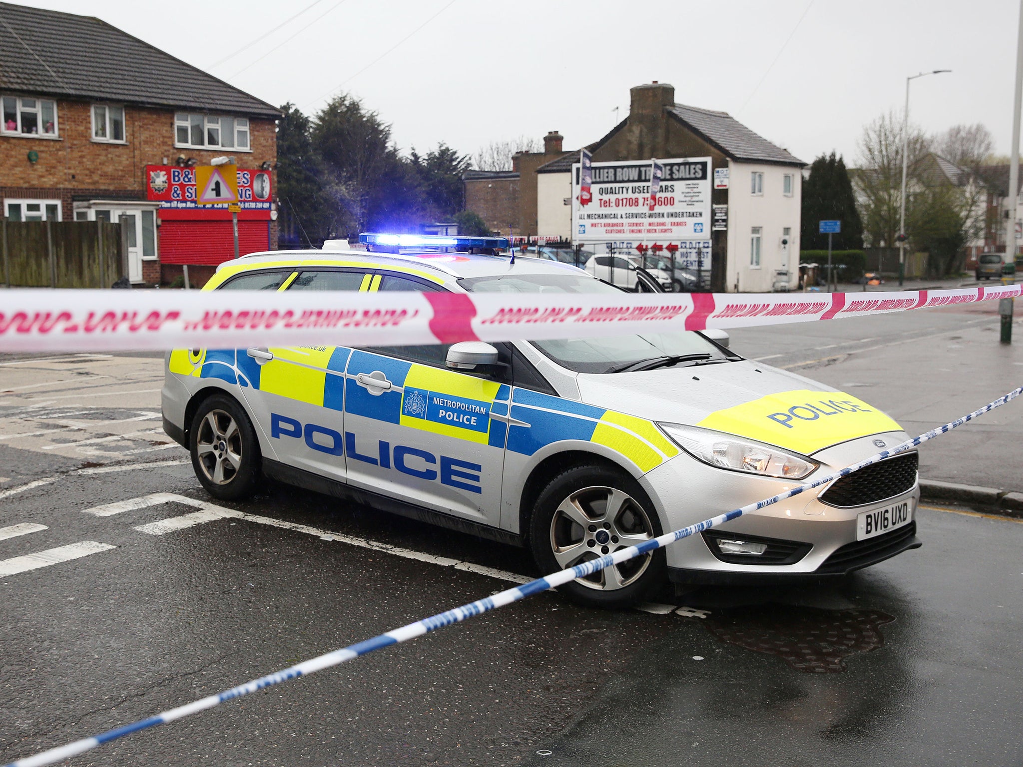 A police car at the junction of Collier Row Road and Ramsden Drive in Romford.