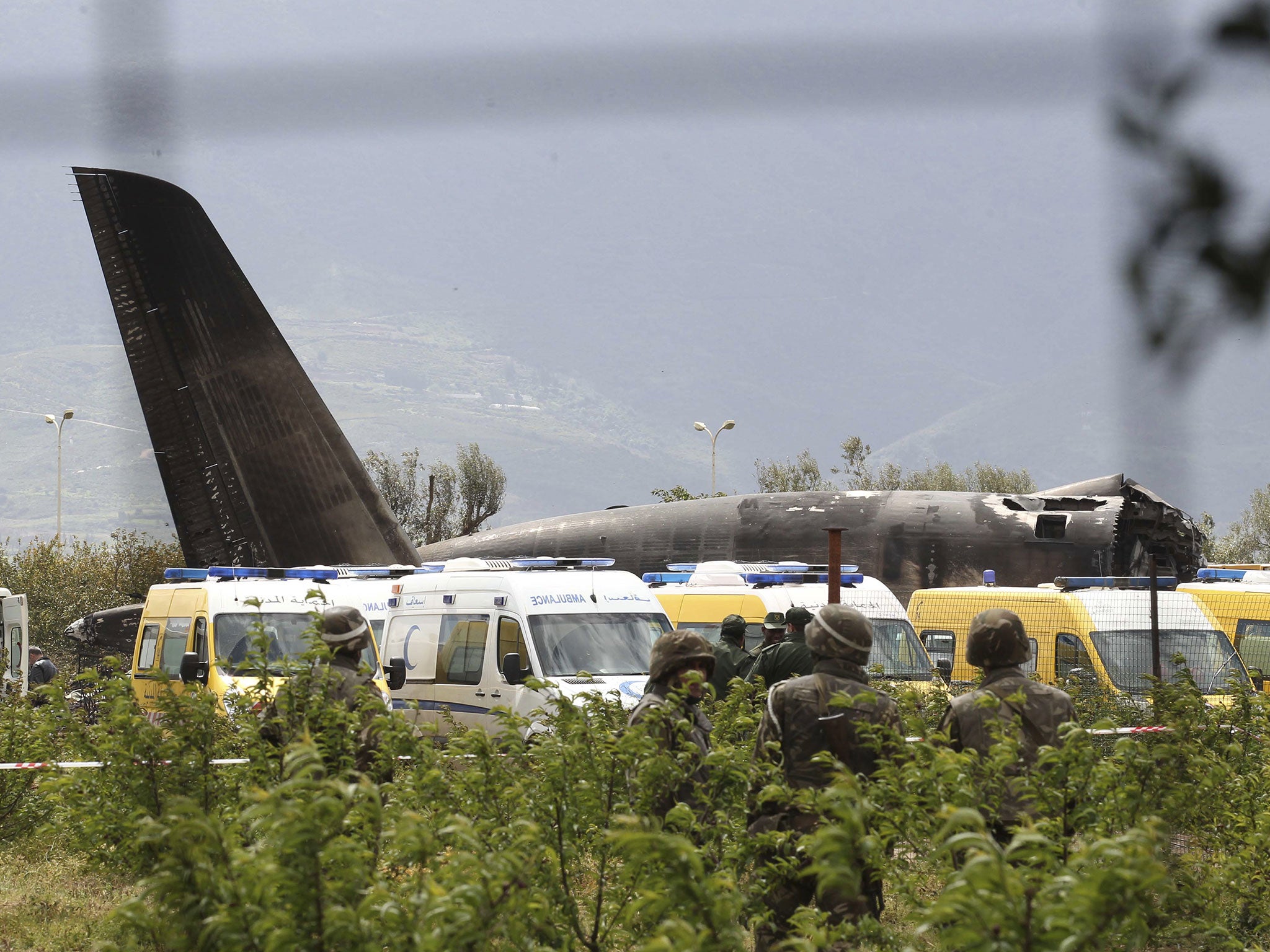 &#13;
Algerian soldiers oversee the wreckage of the military plane after it crashed in Boufarik, near the Algerian capital, Algiers (AP)&#13;