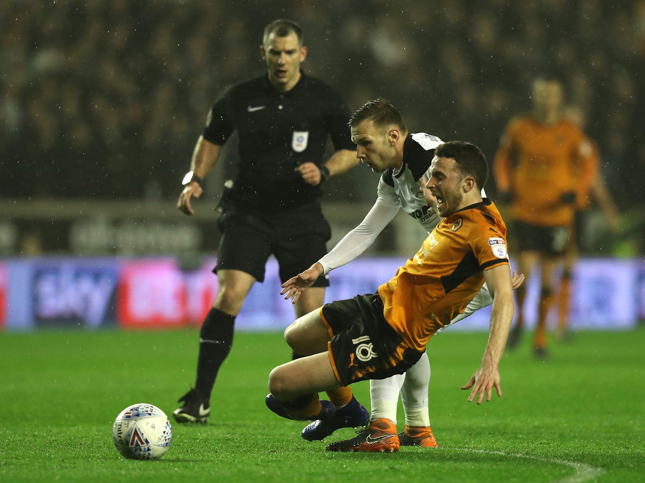 Diogo Jota is brought down by Andreas Weimann