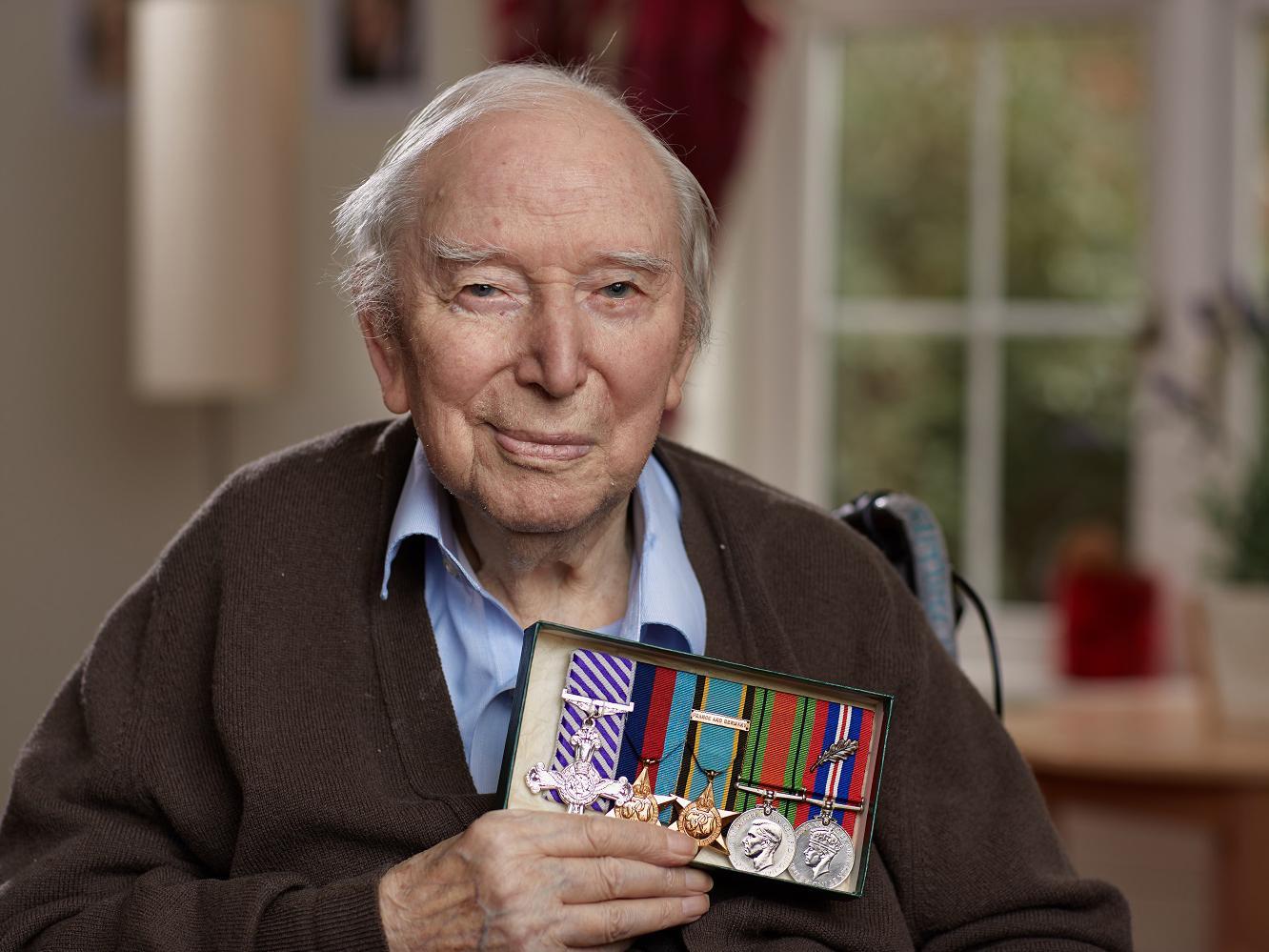 War hero: with his Distinguished Flying Cross medal