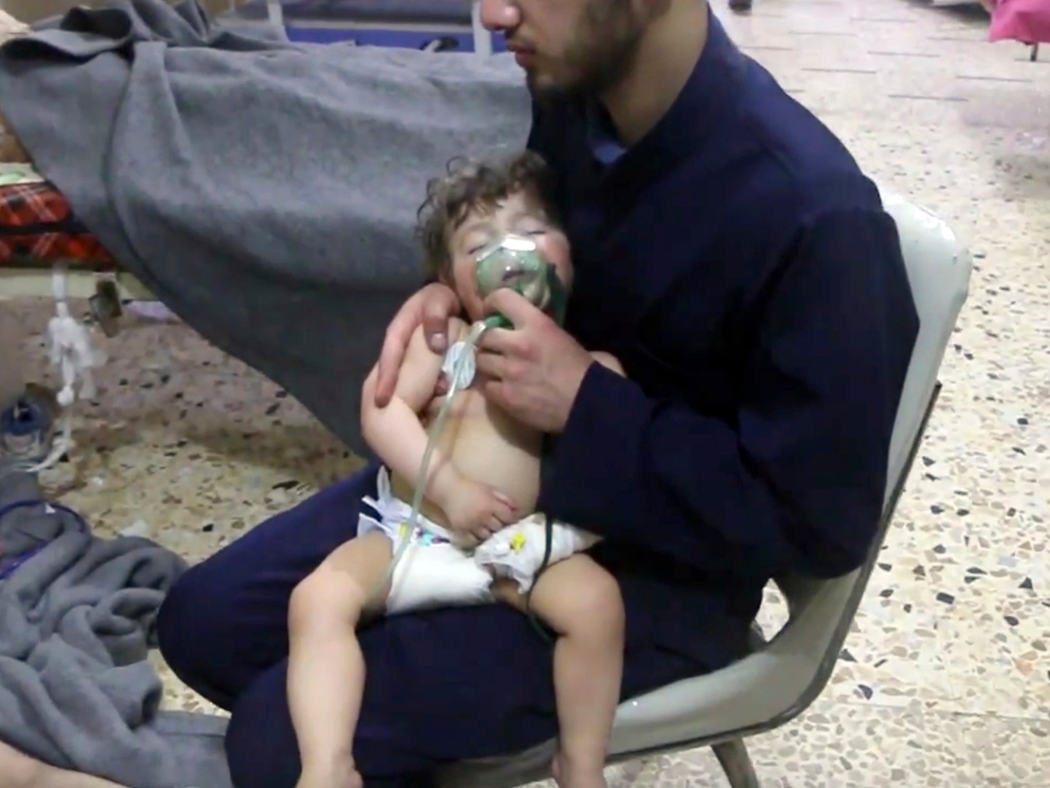 A toddler needs oxygen following a suspected poison gas attack in Douma (Syrian Civil Defence/White Helmets via AP)