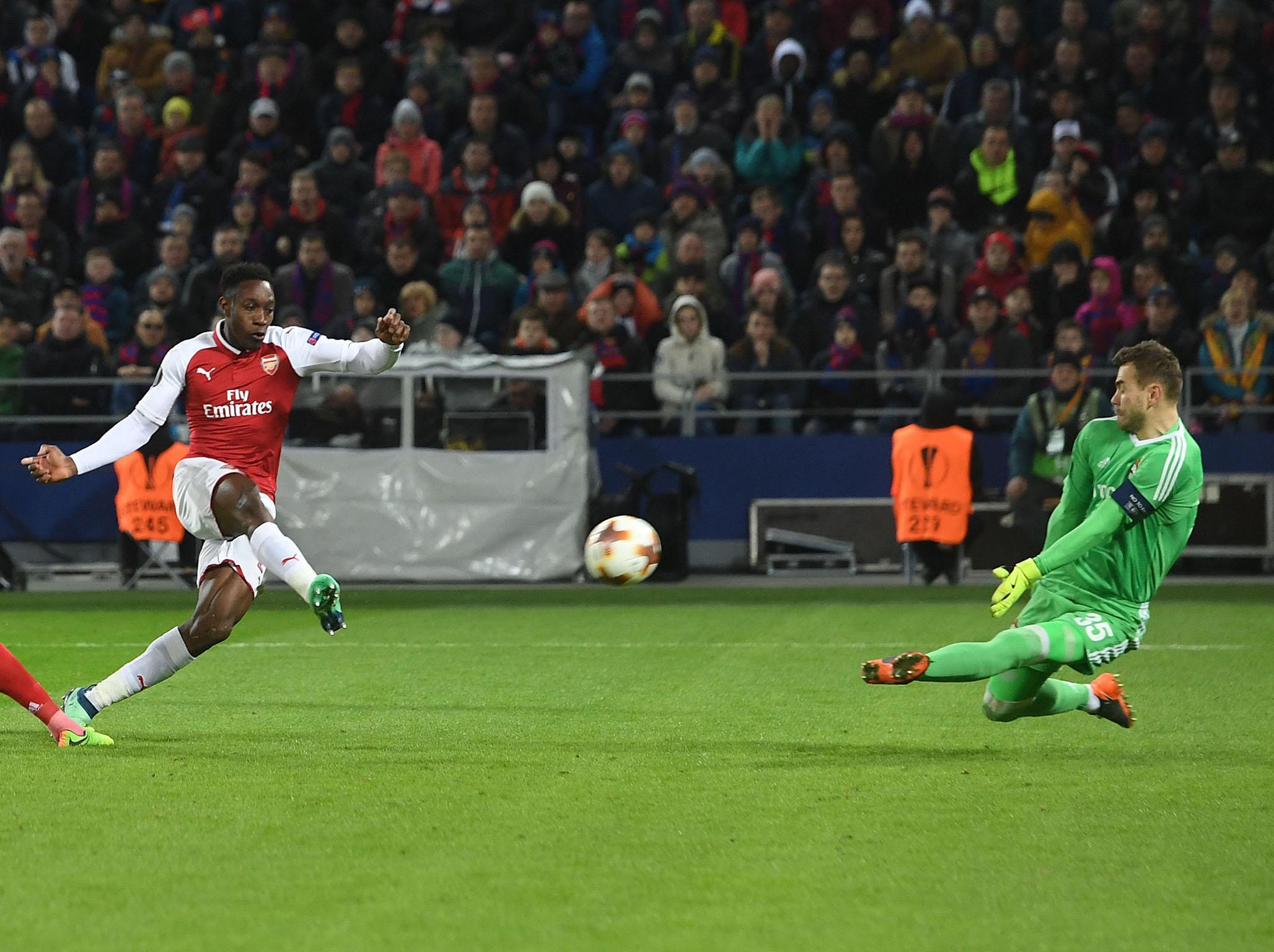 Danny Welbeck bends a finish around Igor Akinfeev