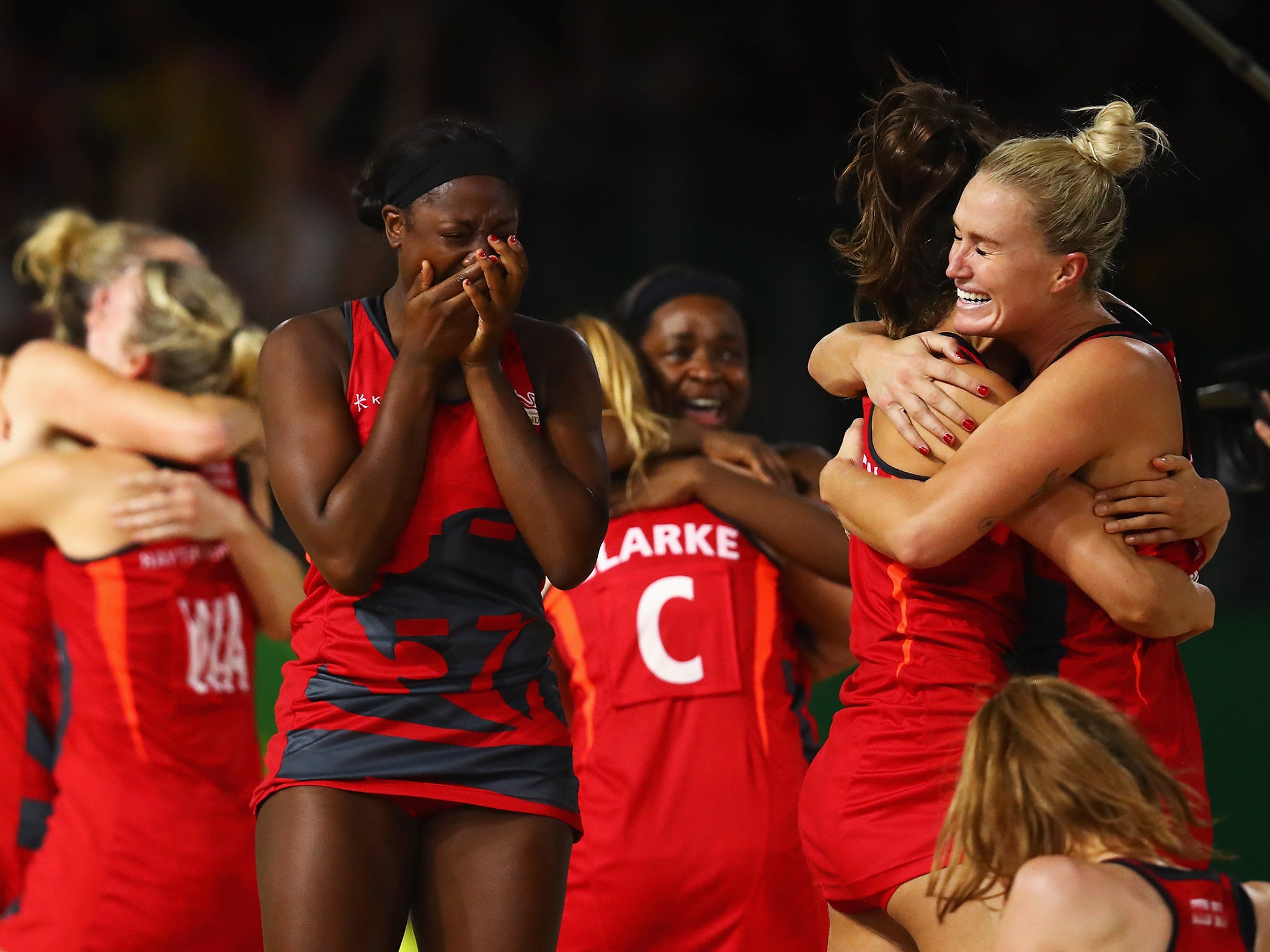 Team England celebrate reaching the netball Commonwealth Games final