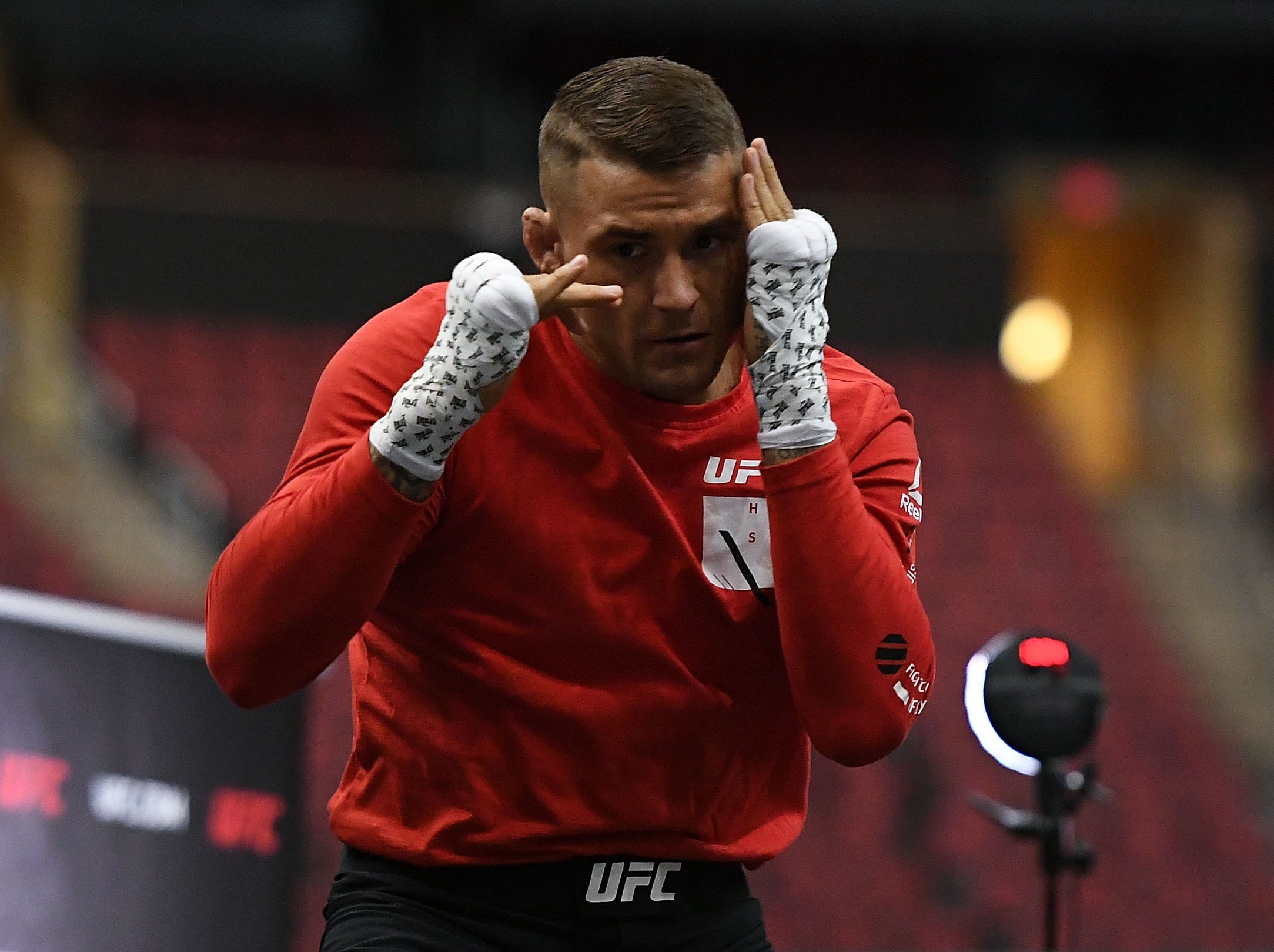 Dustin Poirier likes to fight in a phone box