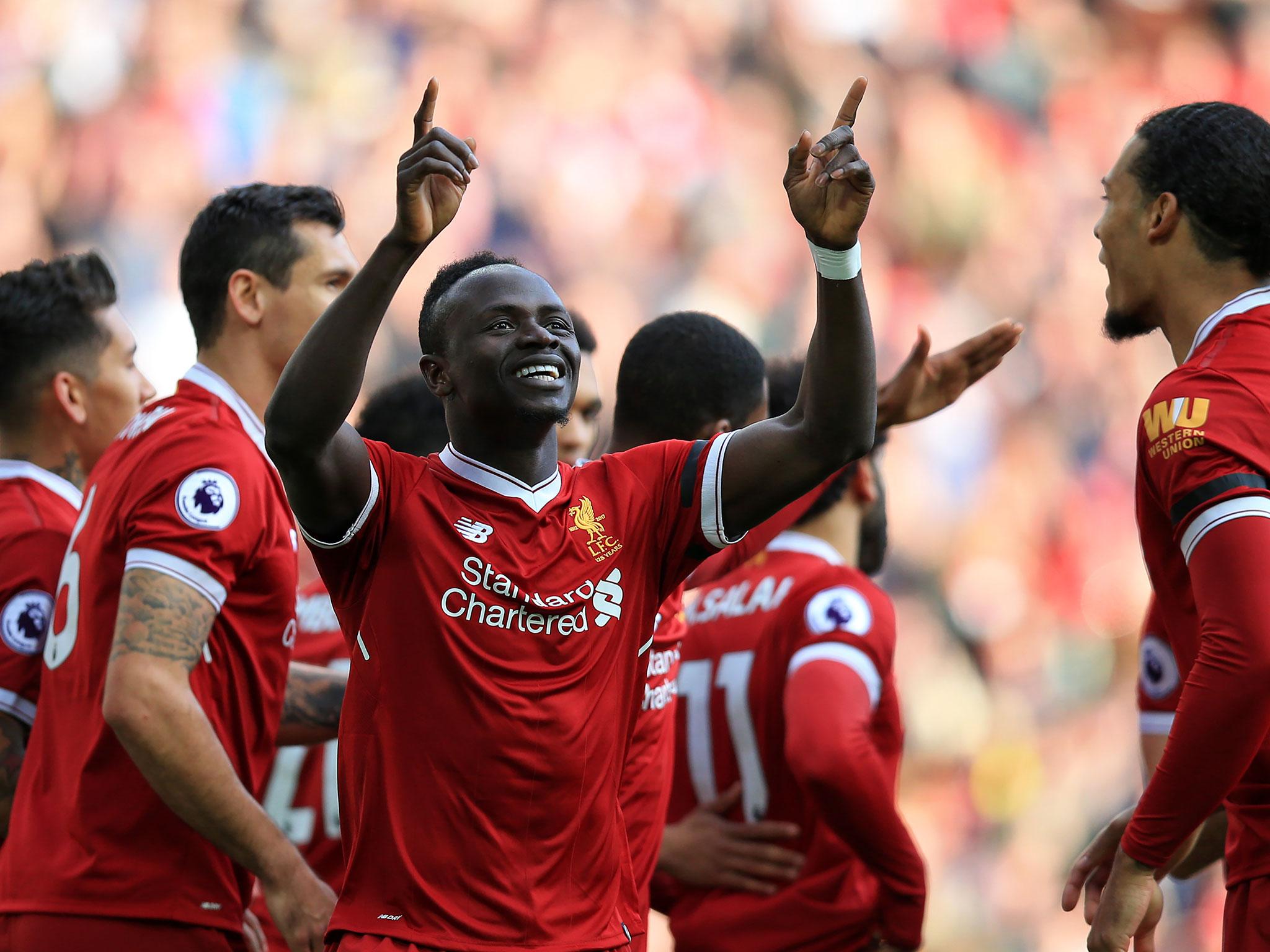 Sadio Mane celebrates opening the scoring for Liverpool at Anfield