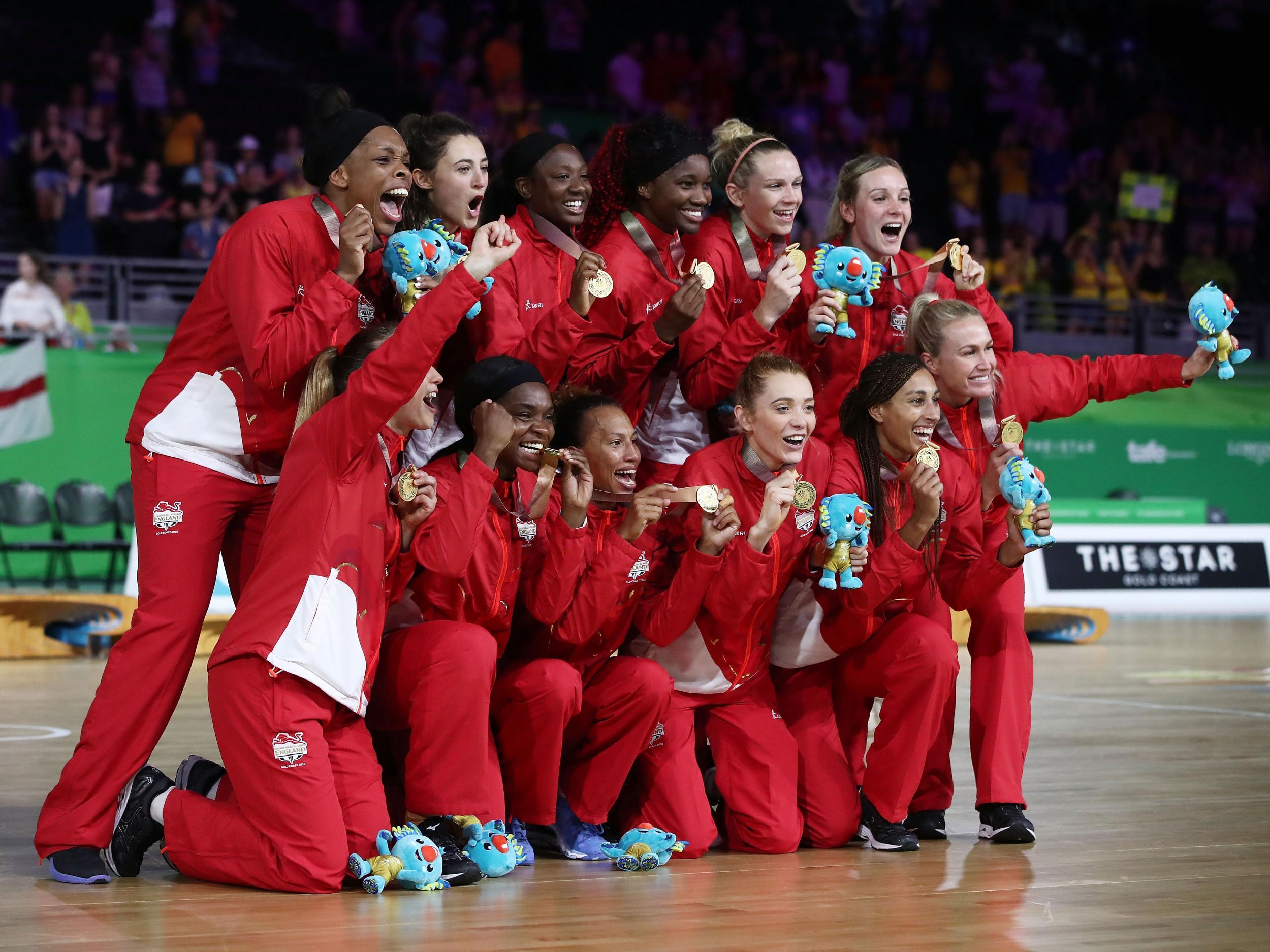 England celebrate with their gold medals