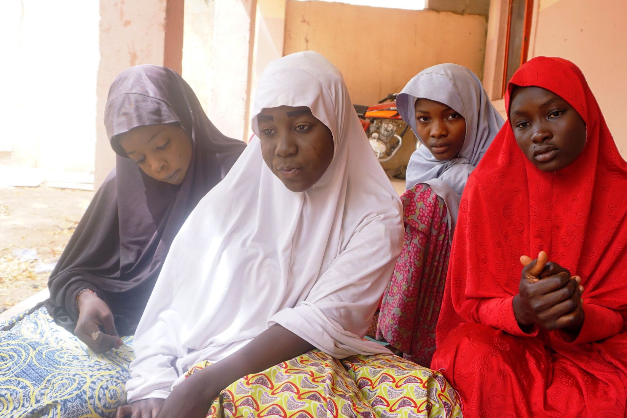 Four schoolgirls who escaped from a recent Boko Haram kidnapping in Dapchi