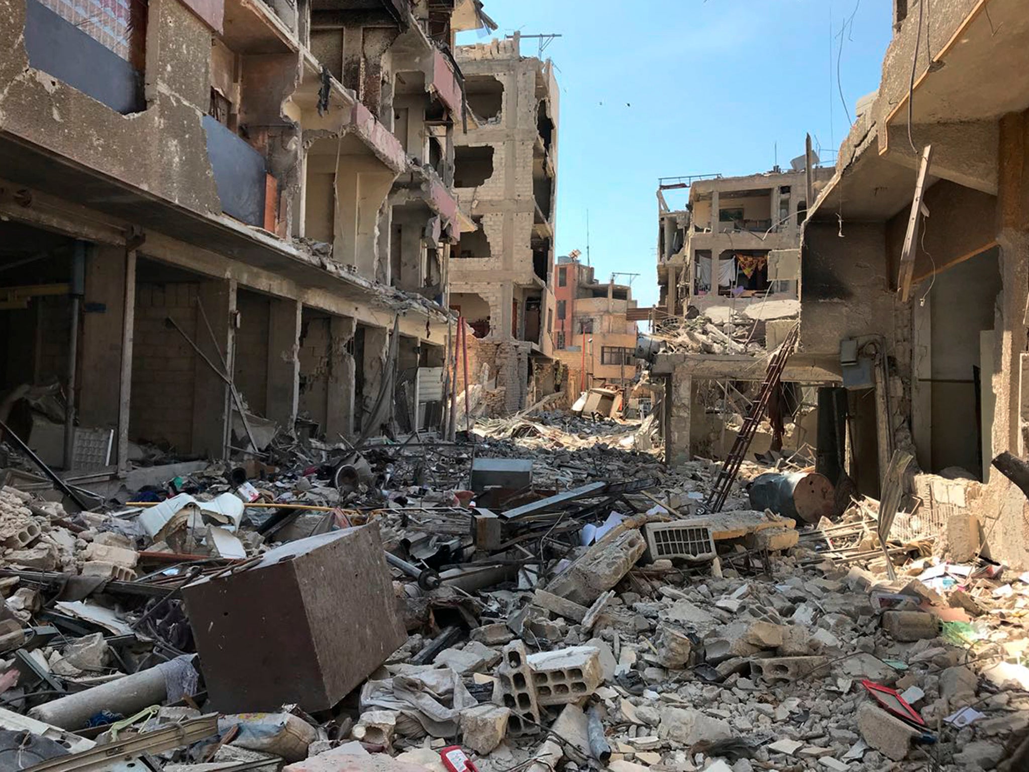 Rubble fills a street in Douma, the site of a suspected chemical weapons attack, near Damascus