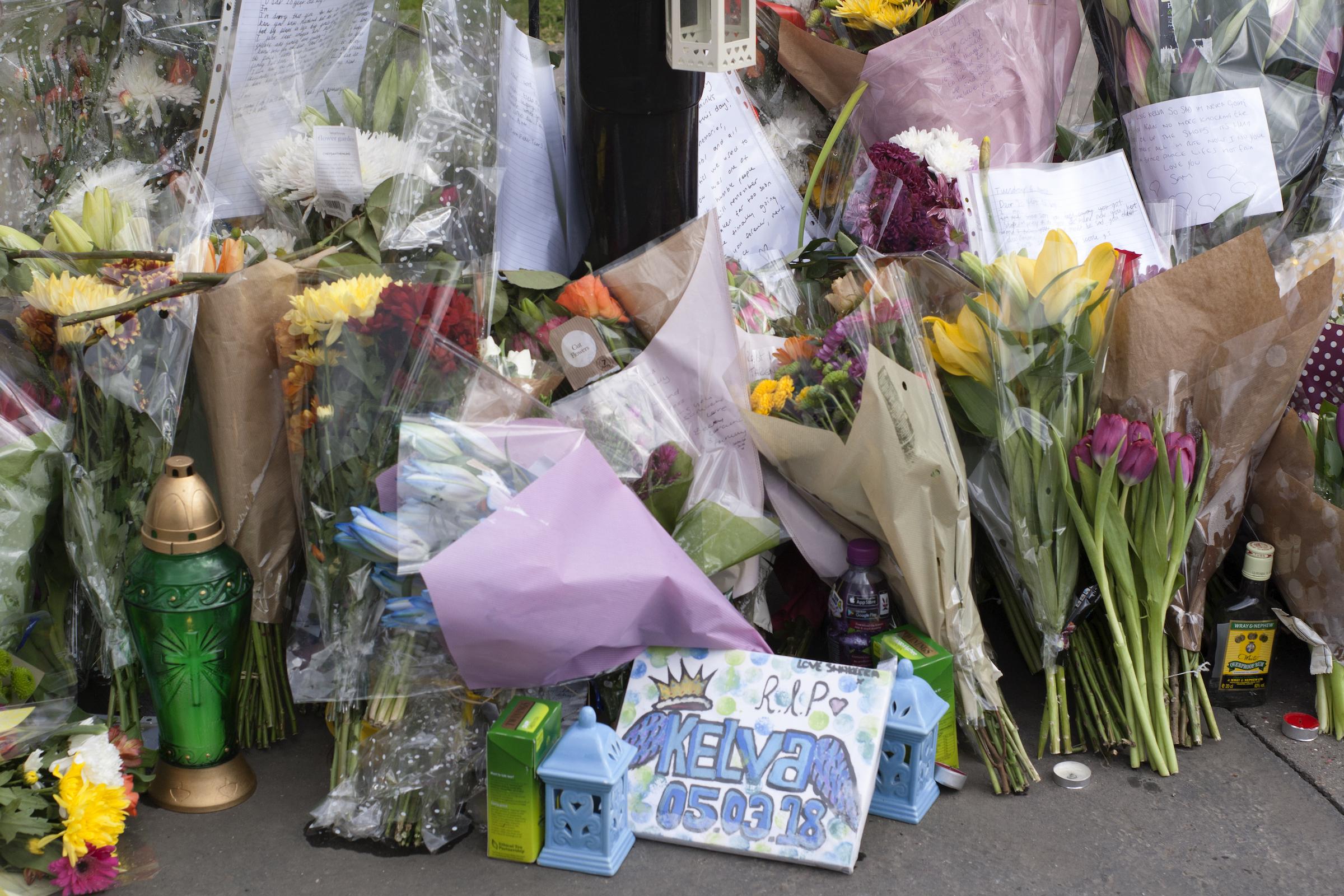 Flowers and cards left in tribute to 20-year-old Kelva Smith, who was stabbed to death in South Norwood last month