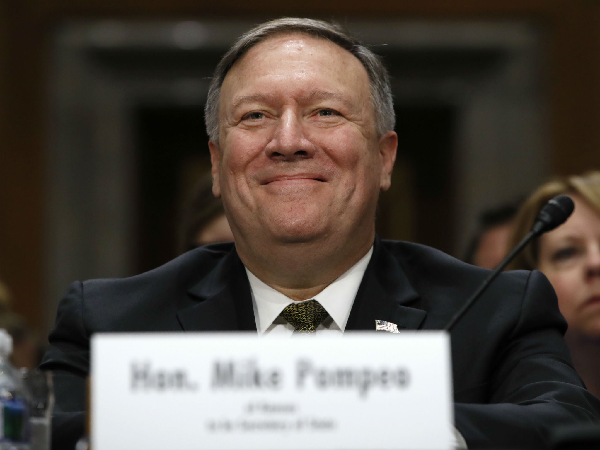 Secretary of State-designate Mike Pompeo smiles after his introduction before the Senate Foreign Relations Committee during a confirmation hearing