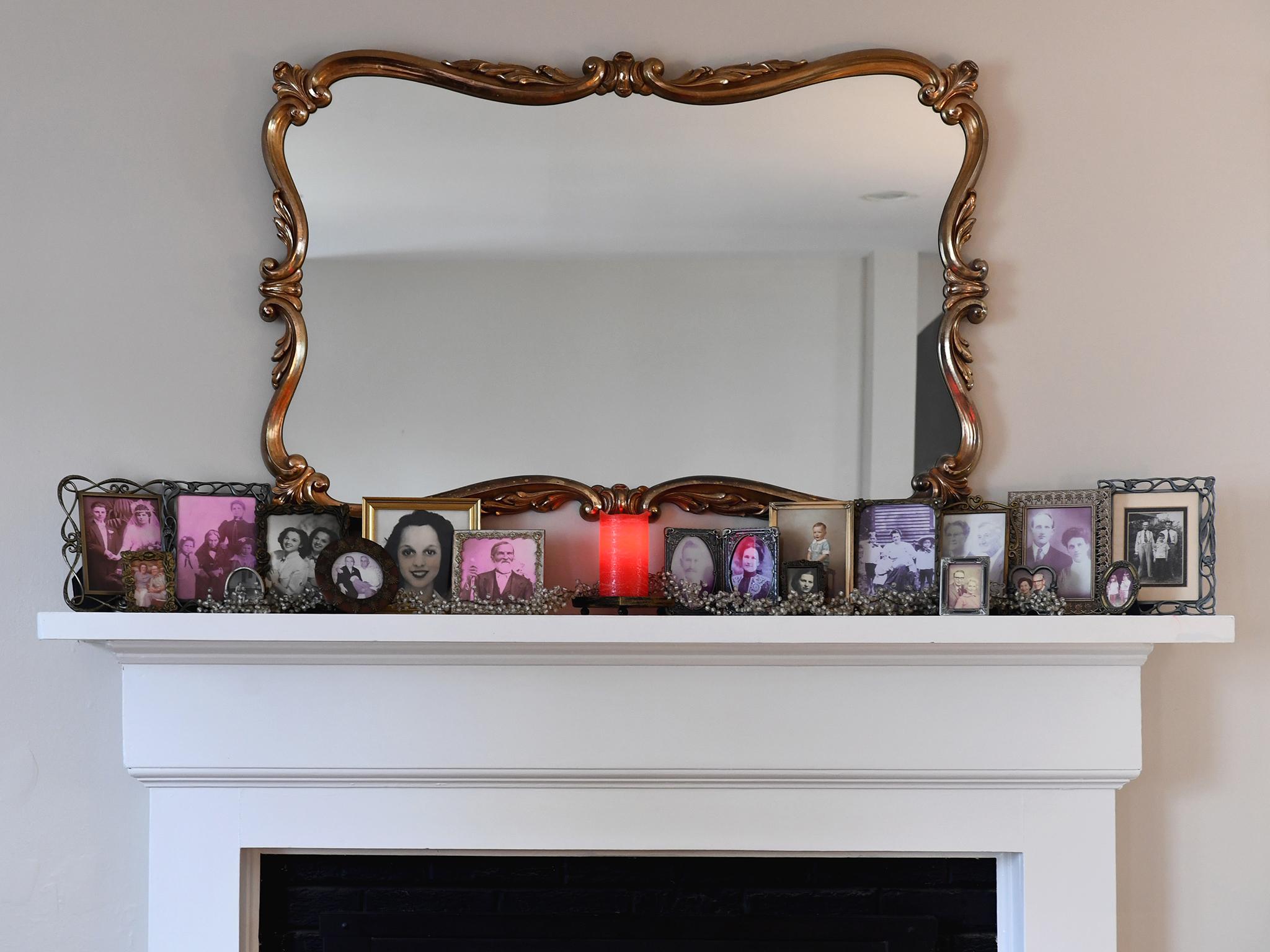 
Family photos line the mantel of the Gibbs/Smith household in Arlington