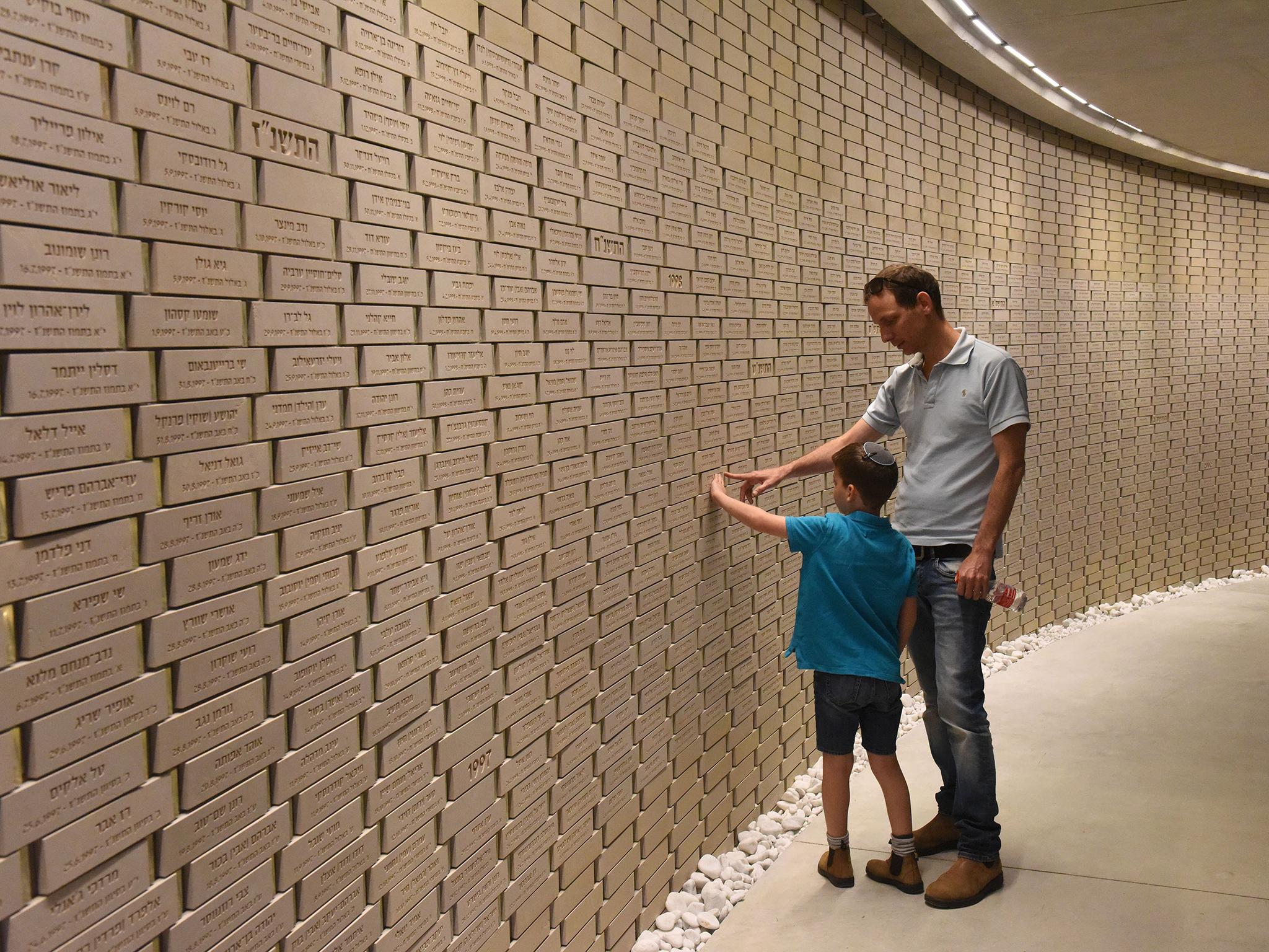 &#13;
Rows of bricks inscribed with names and dates line the rooms, with many more blank and waiting (AFP/Getty)&#13;