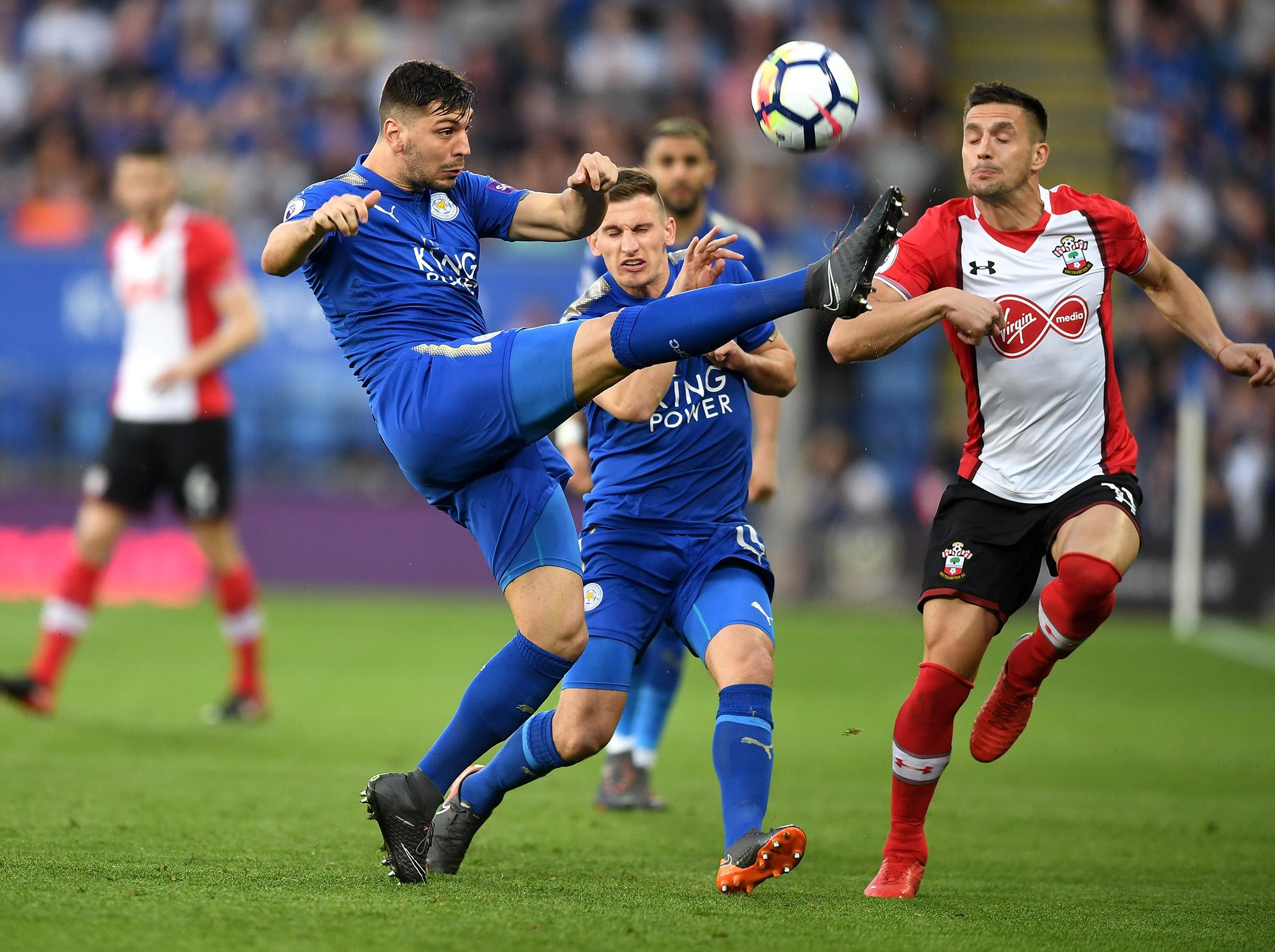 Aleksander Dragovic makes a clearance in defence