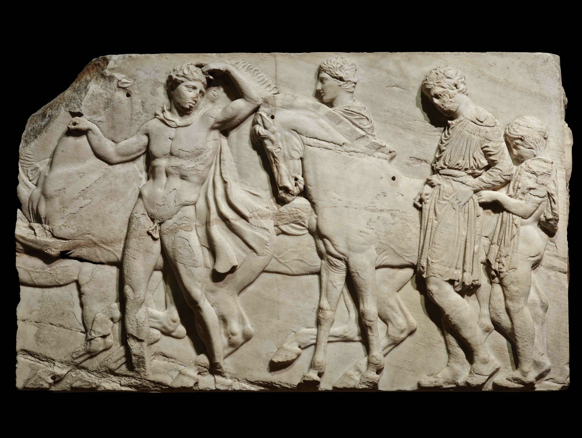 Unmounted youths preparing for the cavalcade, block from the north frieze of the Parthenon, about 438–432 BC