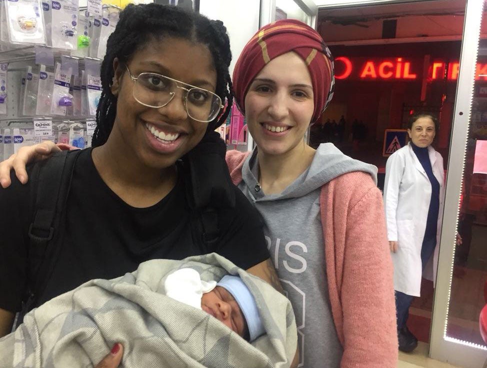 Tia Freeman with her son Xavier after giving birth alone in a hotel room