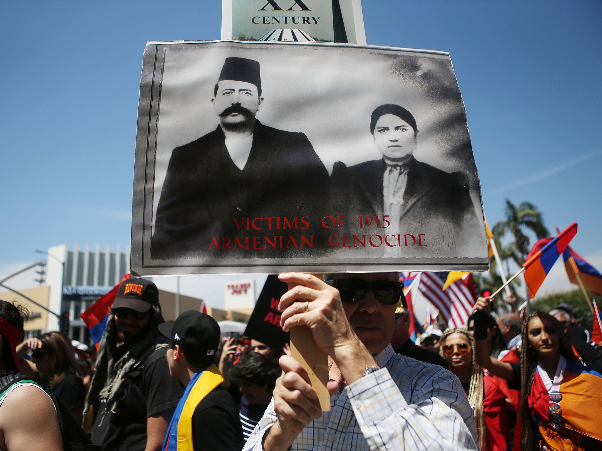 Demonstrators march on the Turkish consulate in Los Angeles during a rally to mark the 103rd anniversary of the Armenian genocide