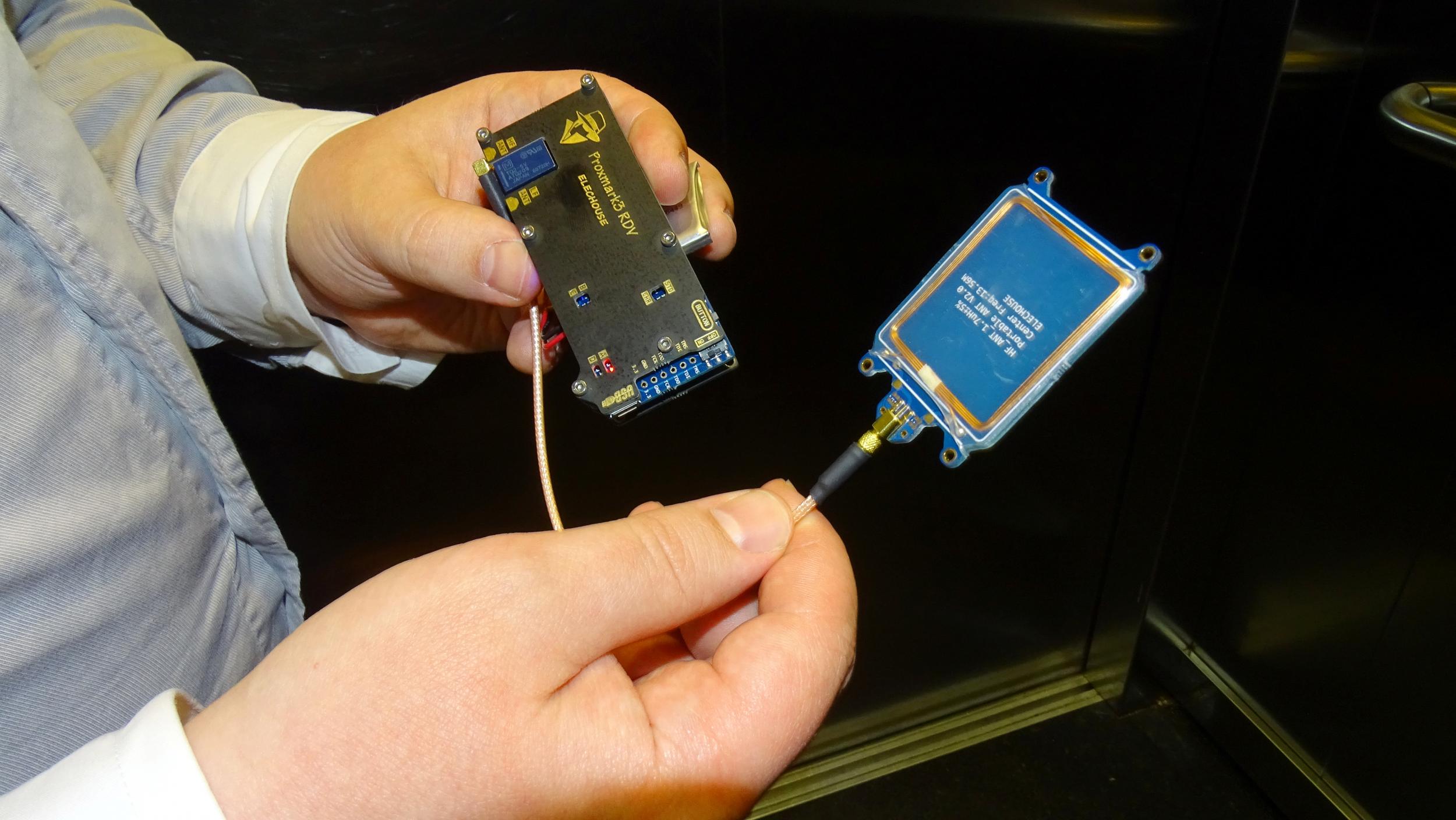 F-Secure researcher Timo Hirvonen shows a device that is able to create a master key out of a single hotel key card in Helsinki, Finland April 19, 2018.