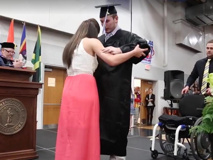 In 2015, Norton walked across the stage for his graduation with the help of his now wife, Emily (People)