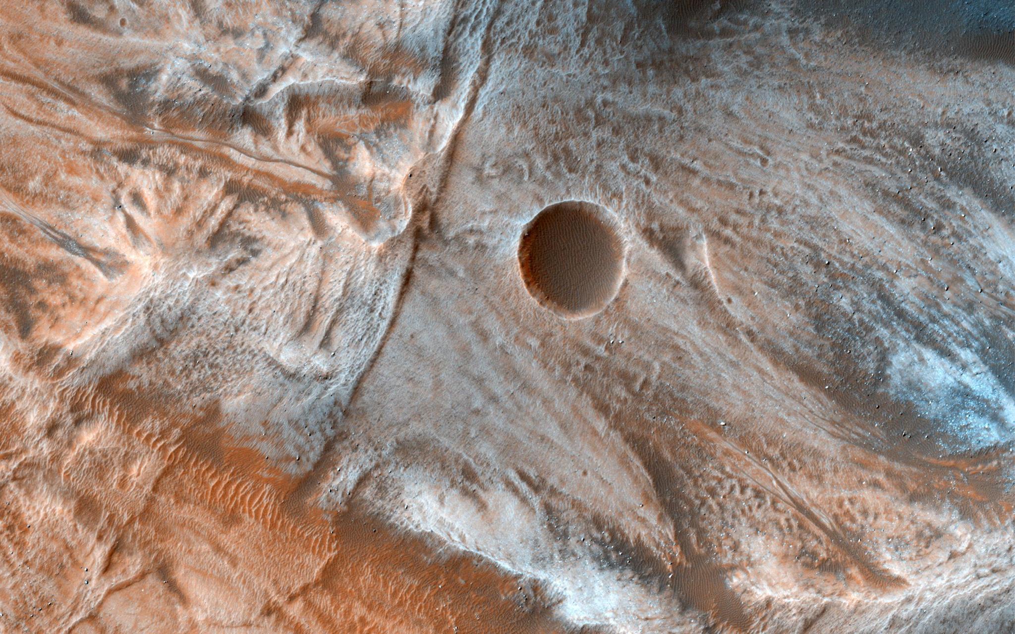 A view of the surface of Mars released by NASA on March 7, 2017, shows viscous, lobate flow features commonly found at the bases of slopes in the mid-latitudes of Mars, and are often associated with gullies