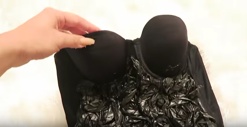 The YouTuber used a black bodysuit as the base for the dress (YouTube)