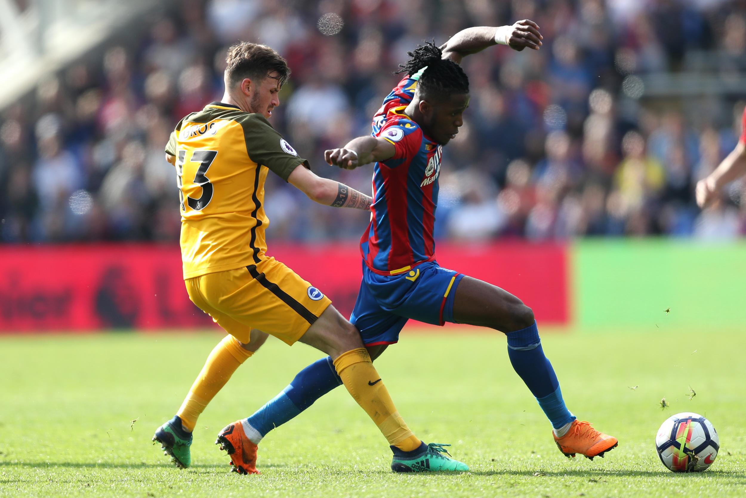 Wilfried Zaha skips past another defender