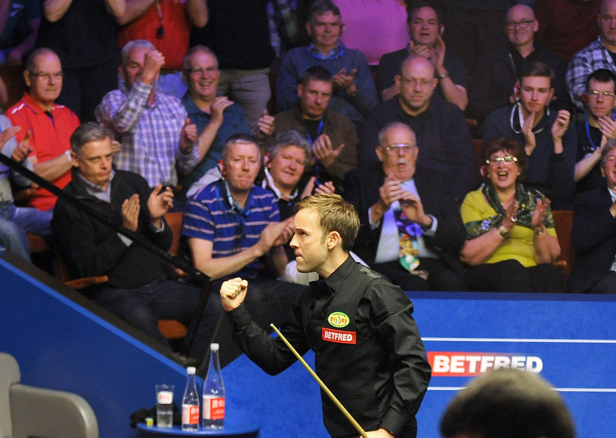 Ali Carter celebrates his victory at the Crucible