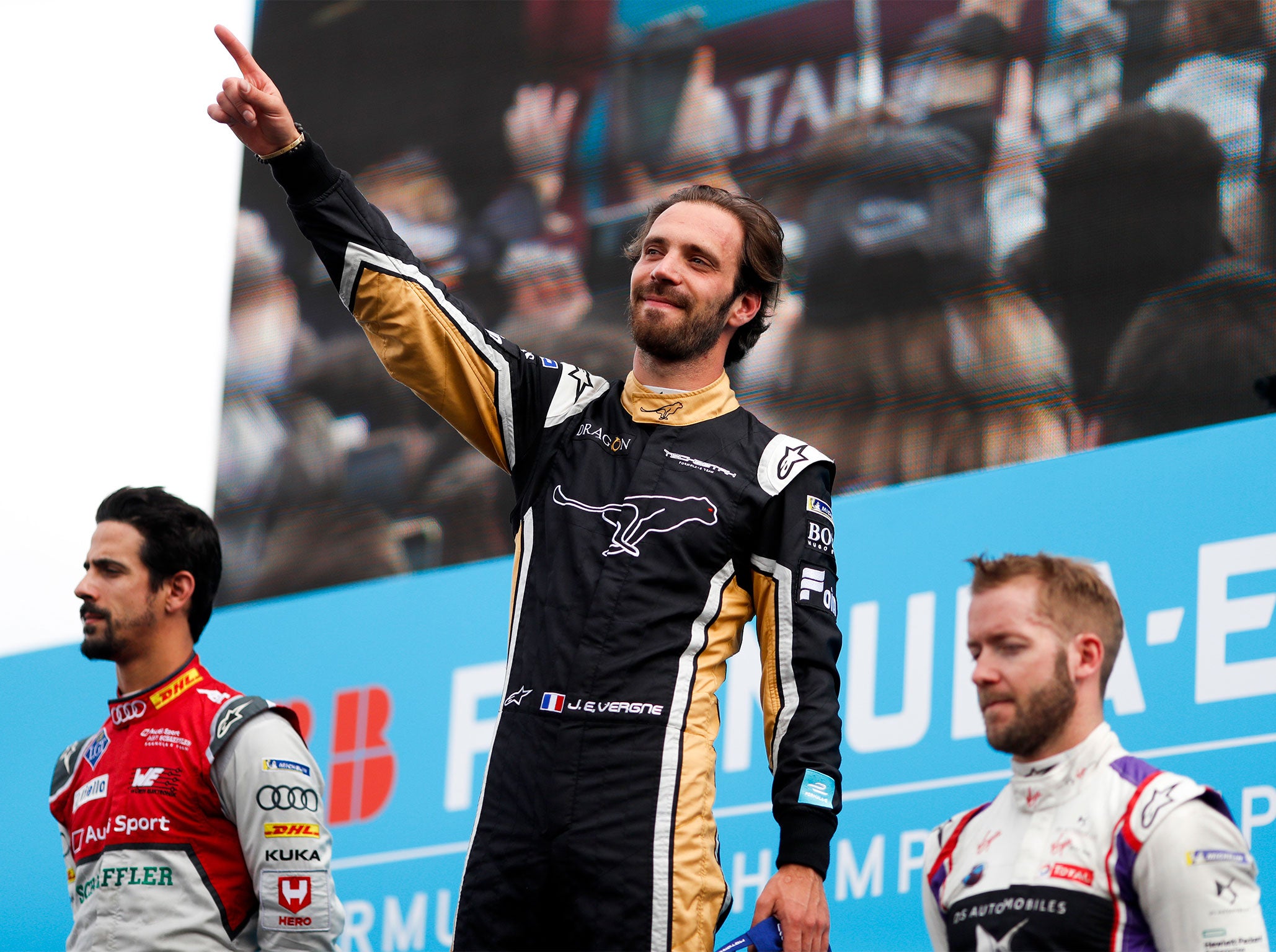 Jean-Eric Vergne (c) celebrates victory with Sam Bird (r) in third