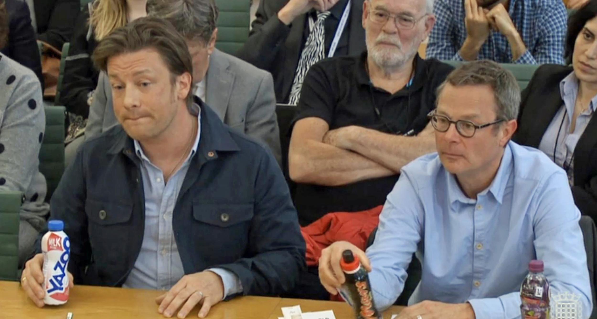 Oliver and Hugh Fernley-Whittingstall displaying bottles of milk-based drinks Yazoo and Mars